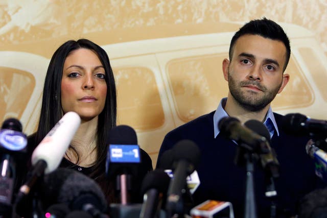 Stephanie Kercher (L) and Lyle Kercher, the sister and brother of murdered British student Meredith Kercher, attend a news conference in Florence   