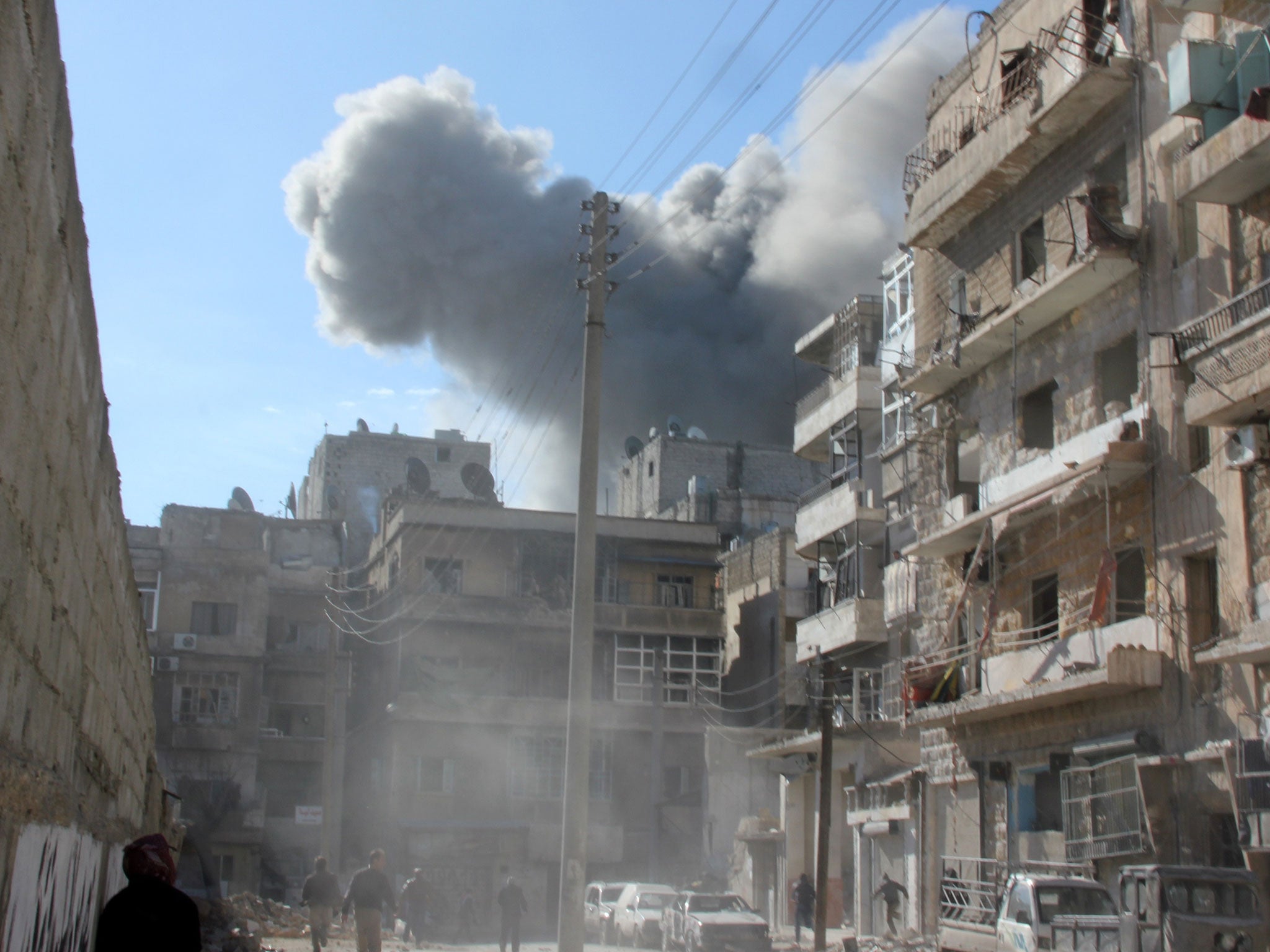 Smoke billows following an alleged air strike by Syrian government forces in the northern Syrian city of Aleppo
