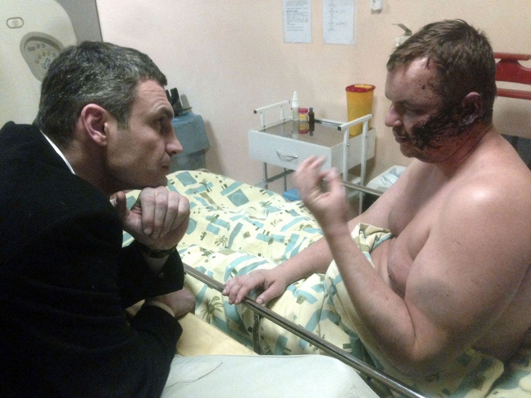 Opposition leader Vitali Klitschko visits Dmytro Bulatov, who claims he was tortured, in hospital, in Kiev