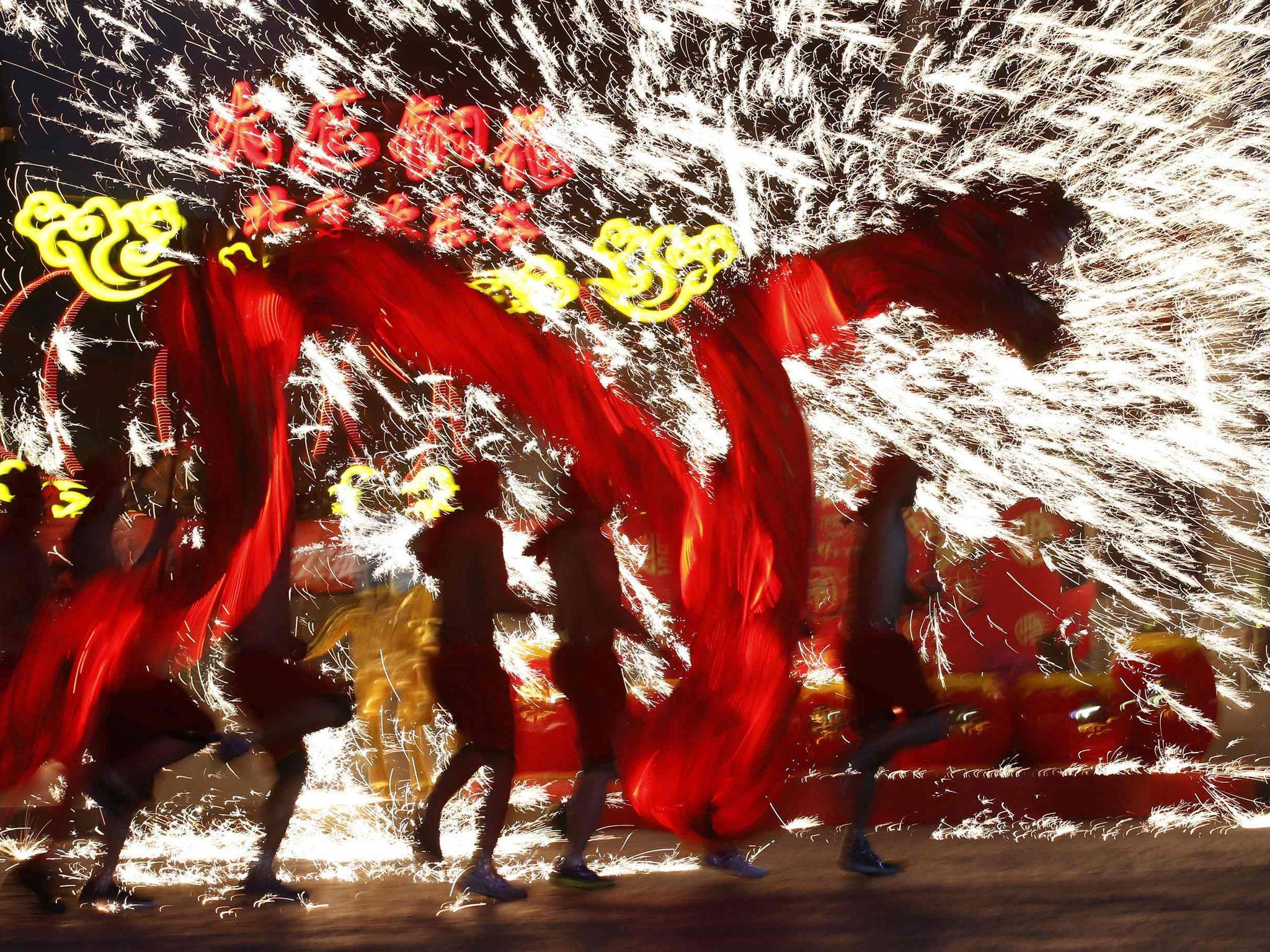 Dancers perform a fire dragon dance in Beijing