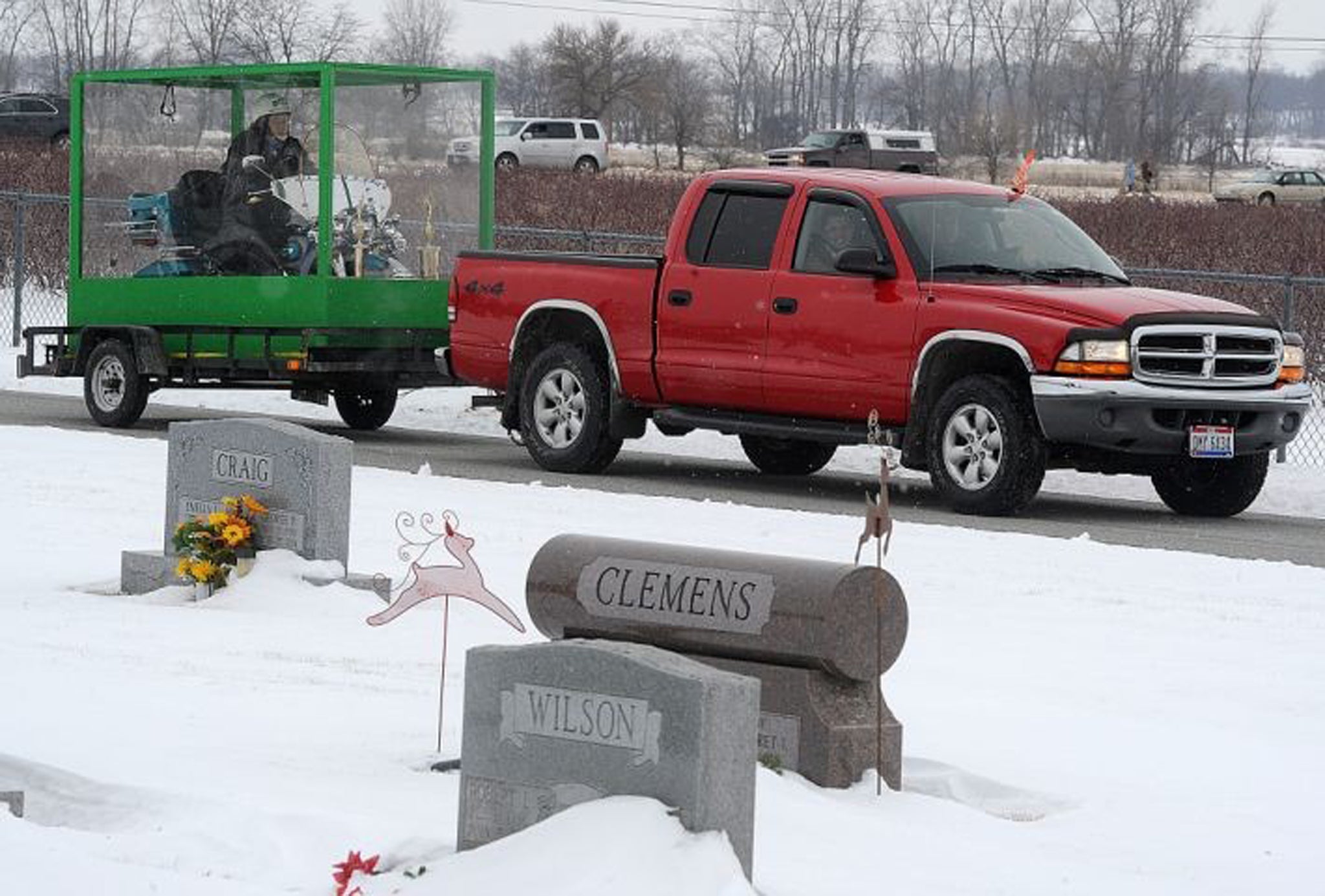 Mr Standley's body is towed to Fairview Cemetery