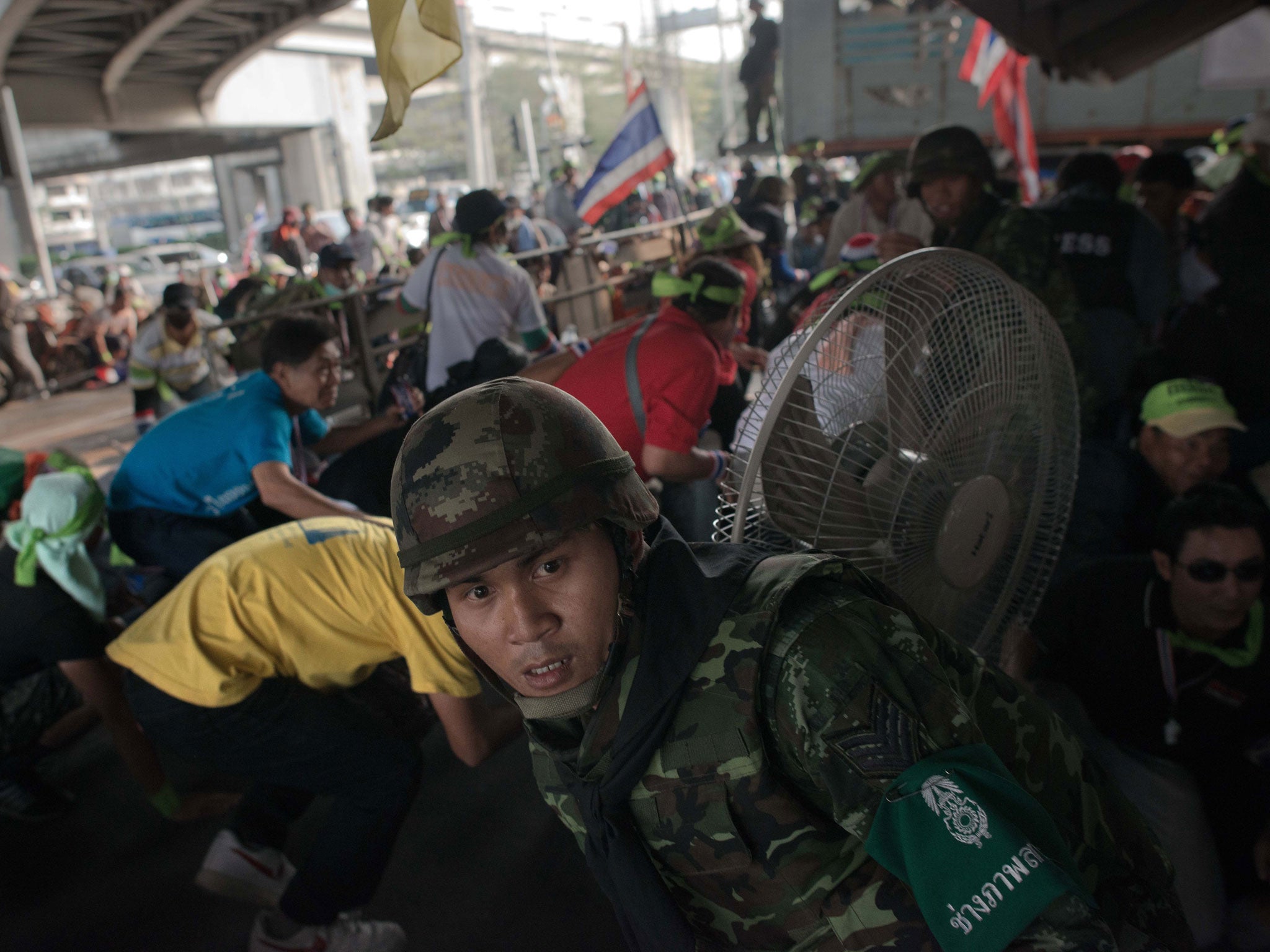 People take cover from gunfire