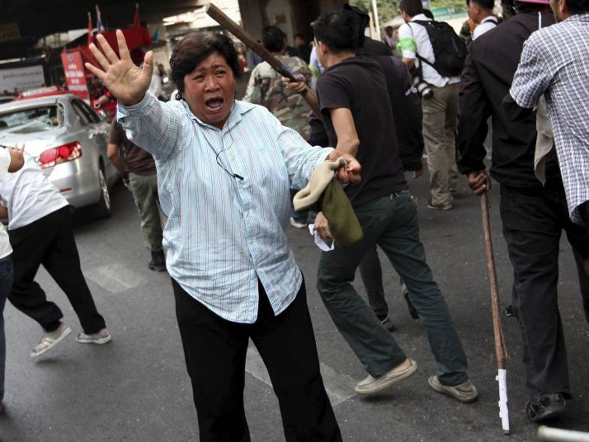 Protesters clash yesterday at a polling station in Bangkok’s Lak Si district