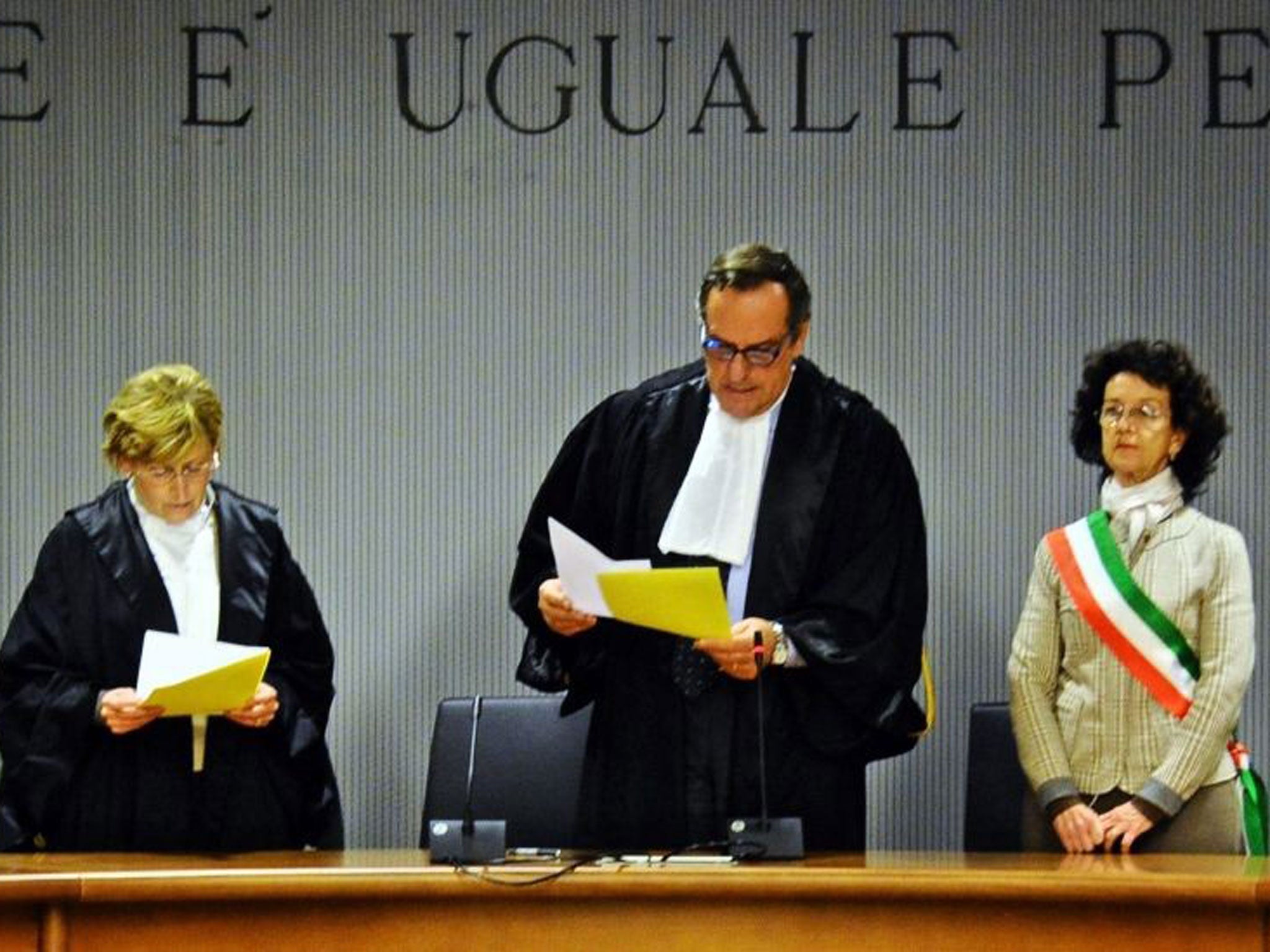 Alessandro Nencini (centre) reads the guilty verdict