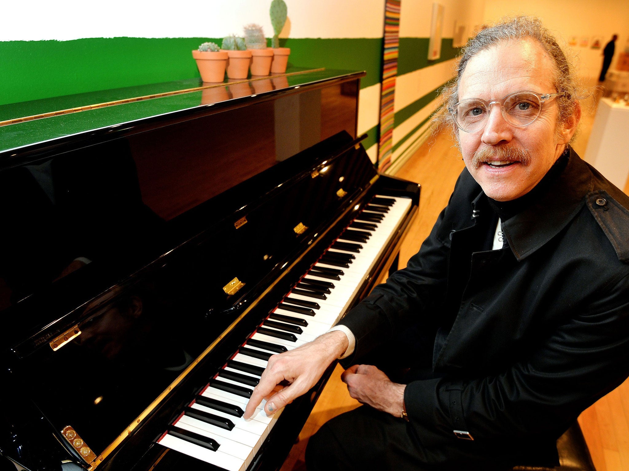 Artist Martin Creed sits at a Piano at the Hayward Gallery