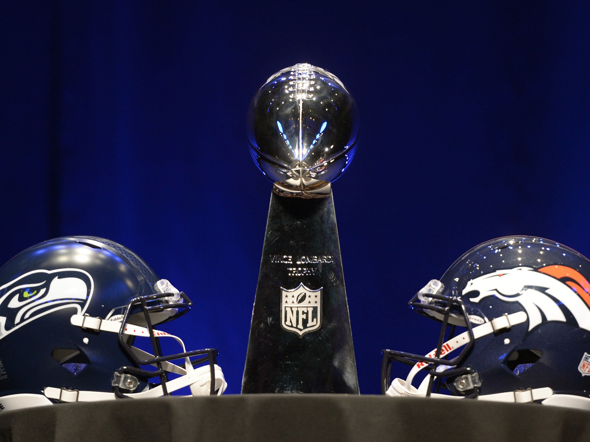 The Vince Lombardi Trophy and helmets for the Denver Broncos(R) and the Seattle Seahawks