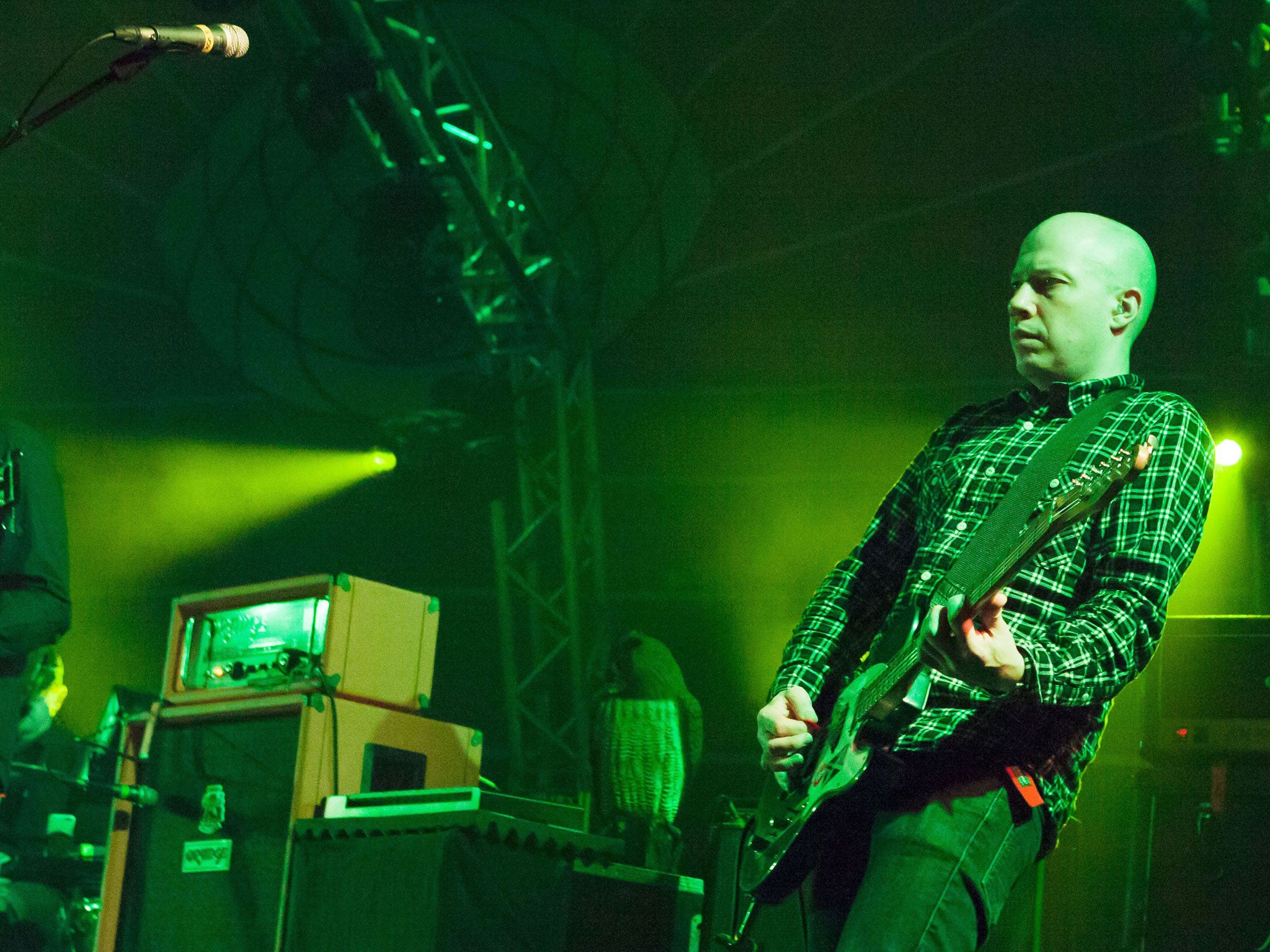 Green zone: Dominic Aitchison of Mogwai, performing in Glasgow