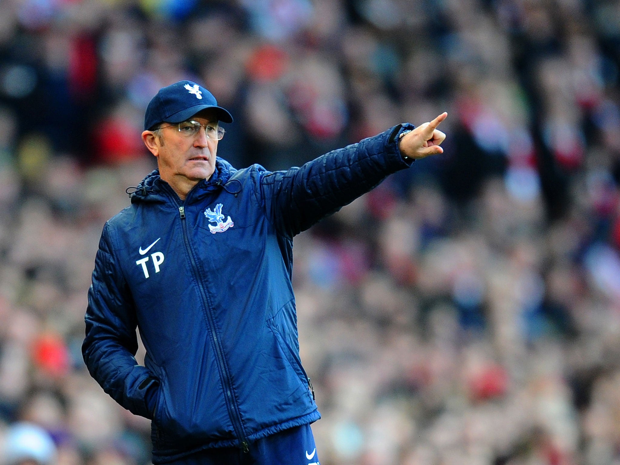 Crystal Palace manager Tony Pulis makes a gesture from the touchline at the Emirates
