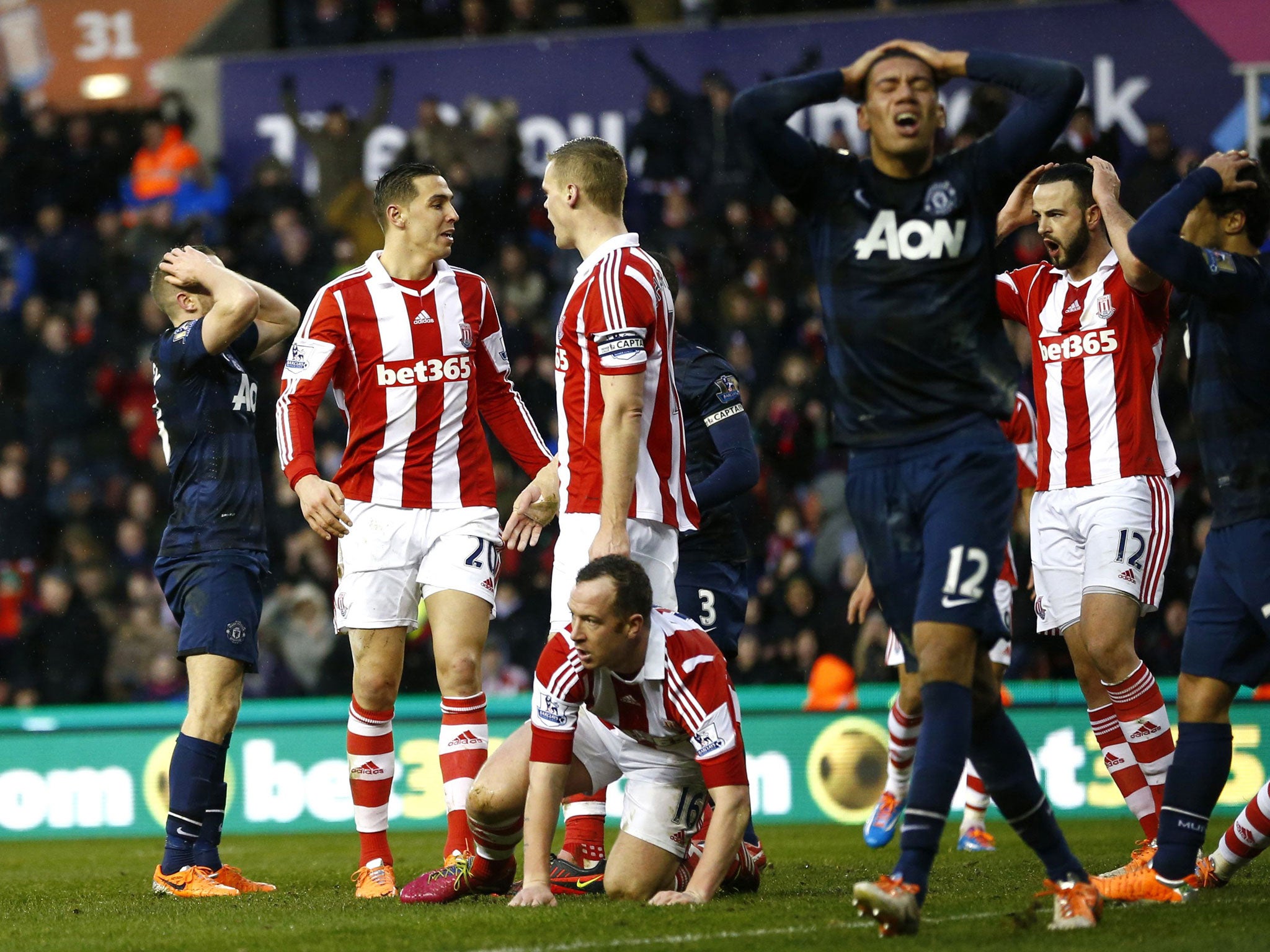 Manchester United players react after a chance goes begging against Stoke