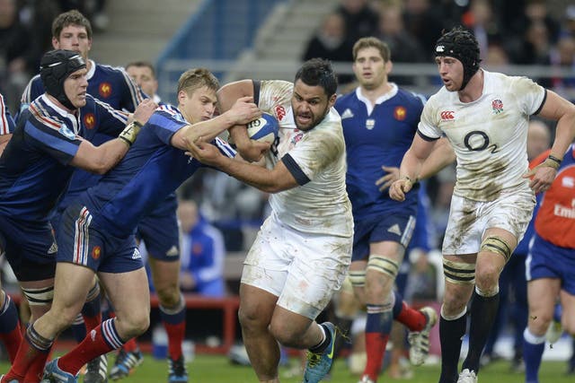 The outstanding Billy Vunipola of England shrugs off the challenge of the French defence during the Six Nations match at the Stade de France