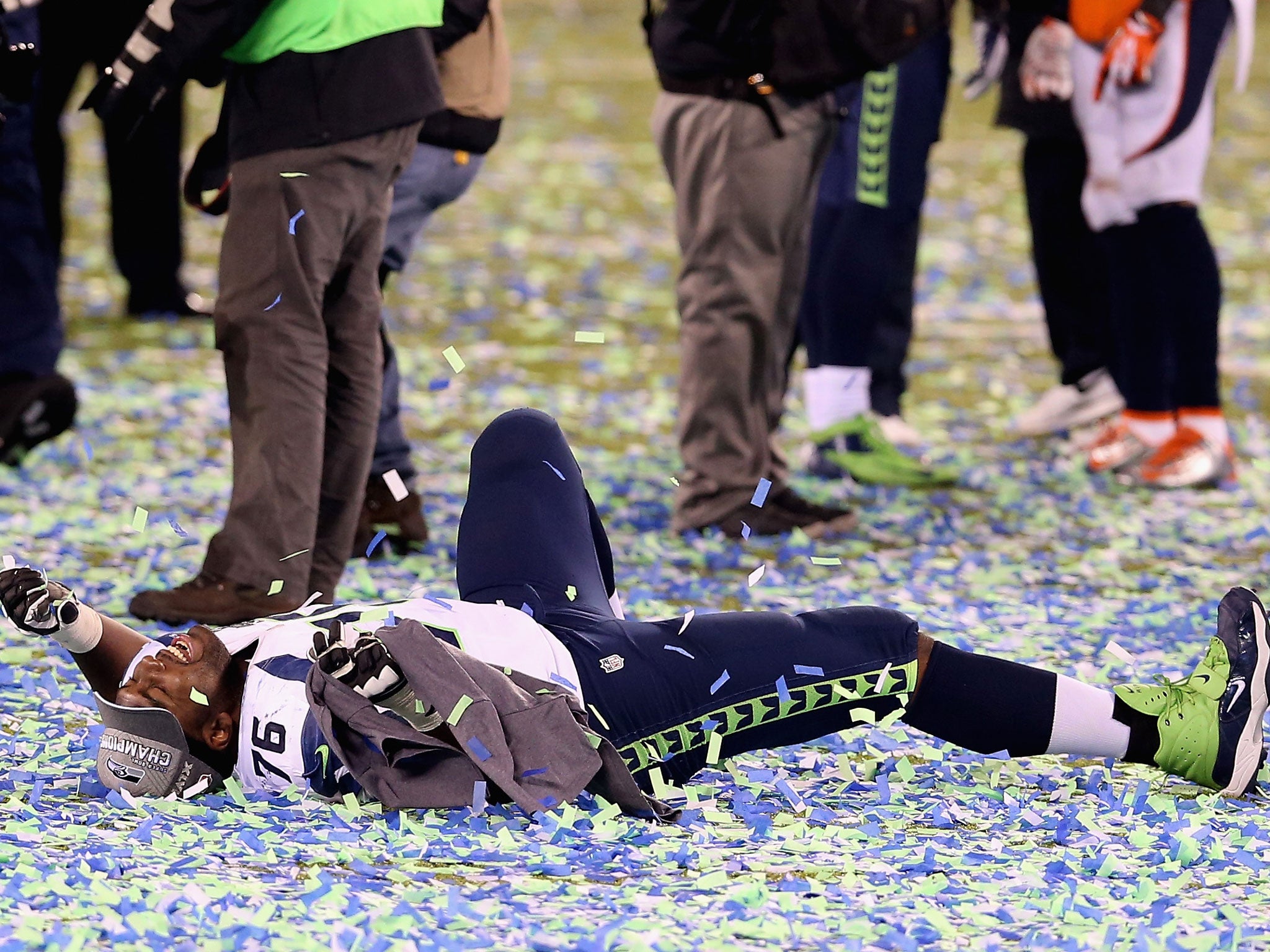 Tackle Russell Okung #76 of the Seattle Seahawks celebrates after winning Super Bowl XLVIII
