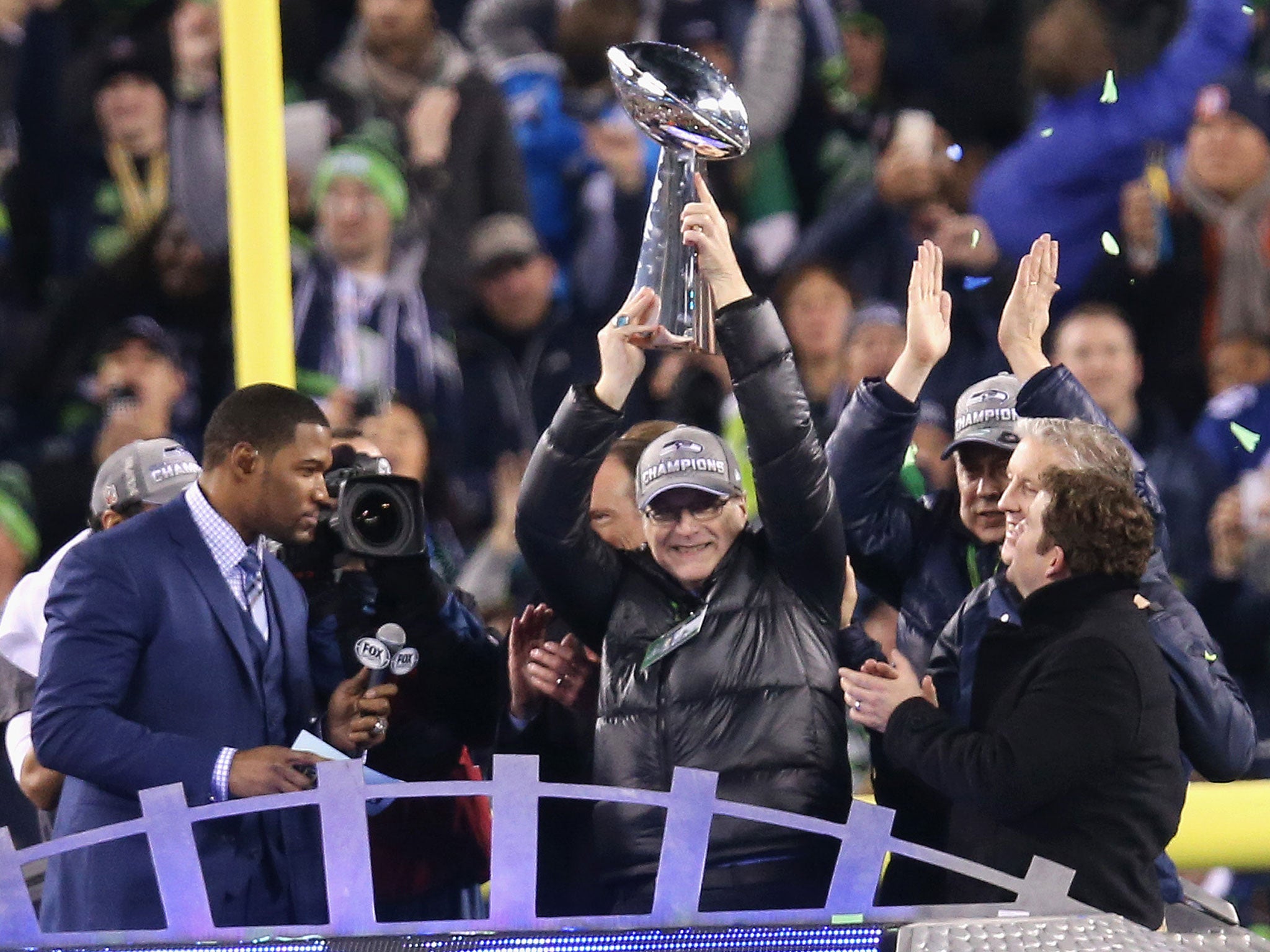 Seattle Seahawks Owner Paul Allen celebrates with the Vince Lombardi Trophy