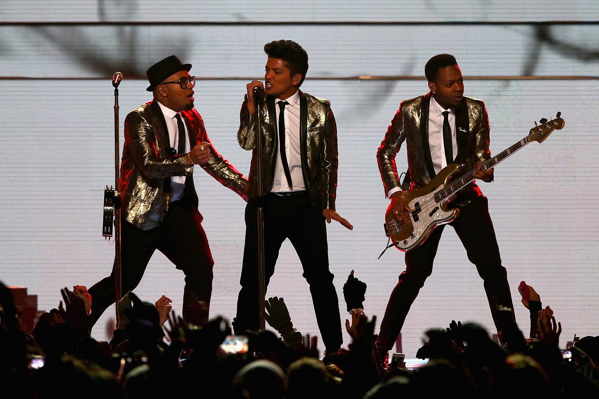 Bruno Mars performs with his backing men during the Super Bowl Halftime show