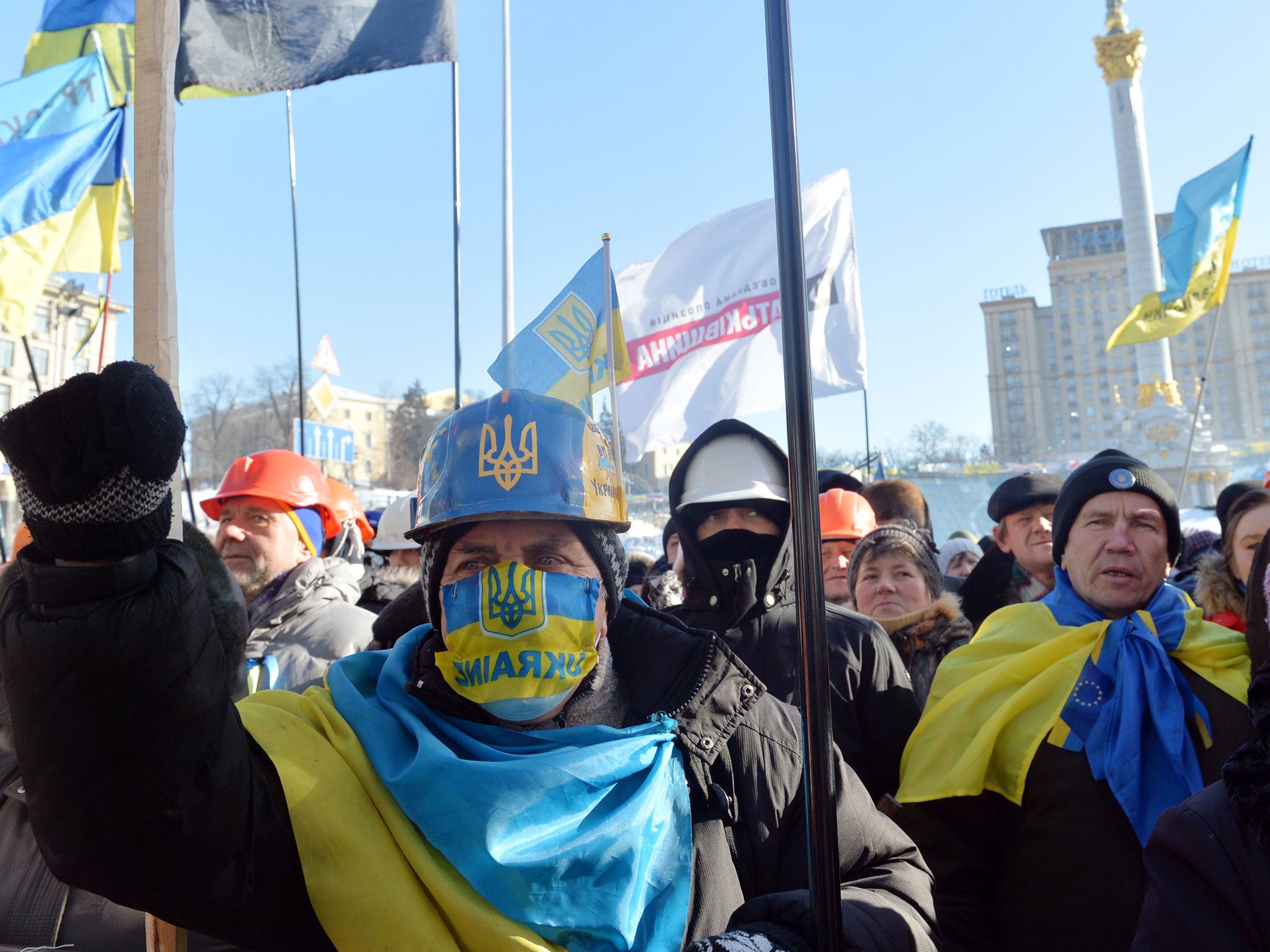 Anti-government protesters take part in a demo in Kiev on 2 February 2014. Ukraine's opposition holds a new rally amid concern about military intervention in the country's worst crisis since independence, after pledges of support from Europe and the Unite