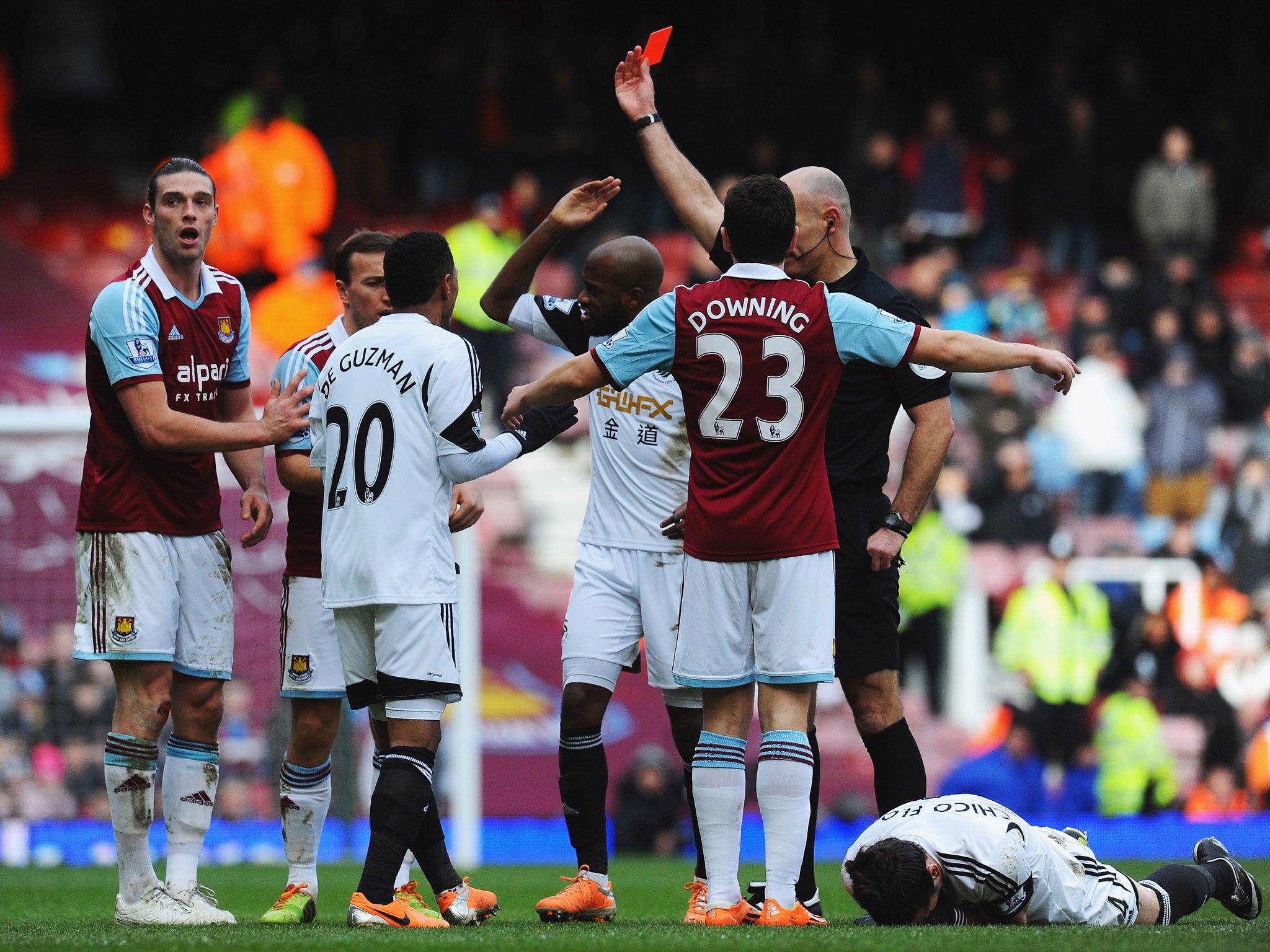 West Ham striker Andy Carroll is shown a red card