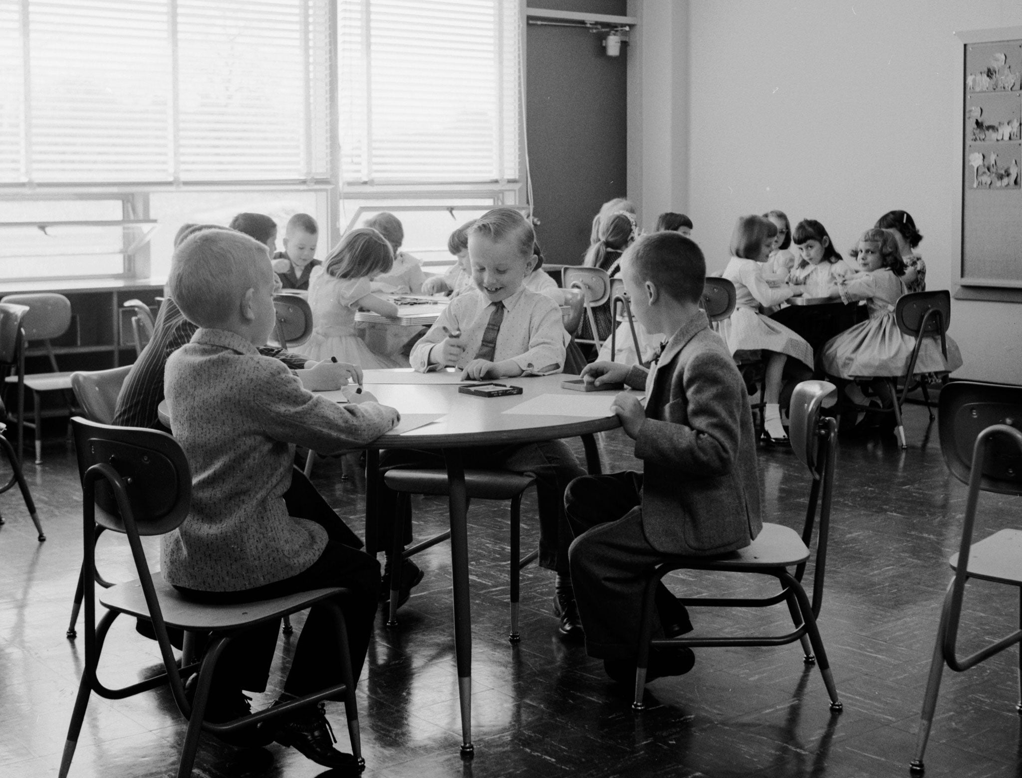 Circa 1956: A group of young children in a schoolroom.