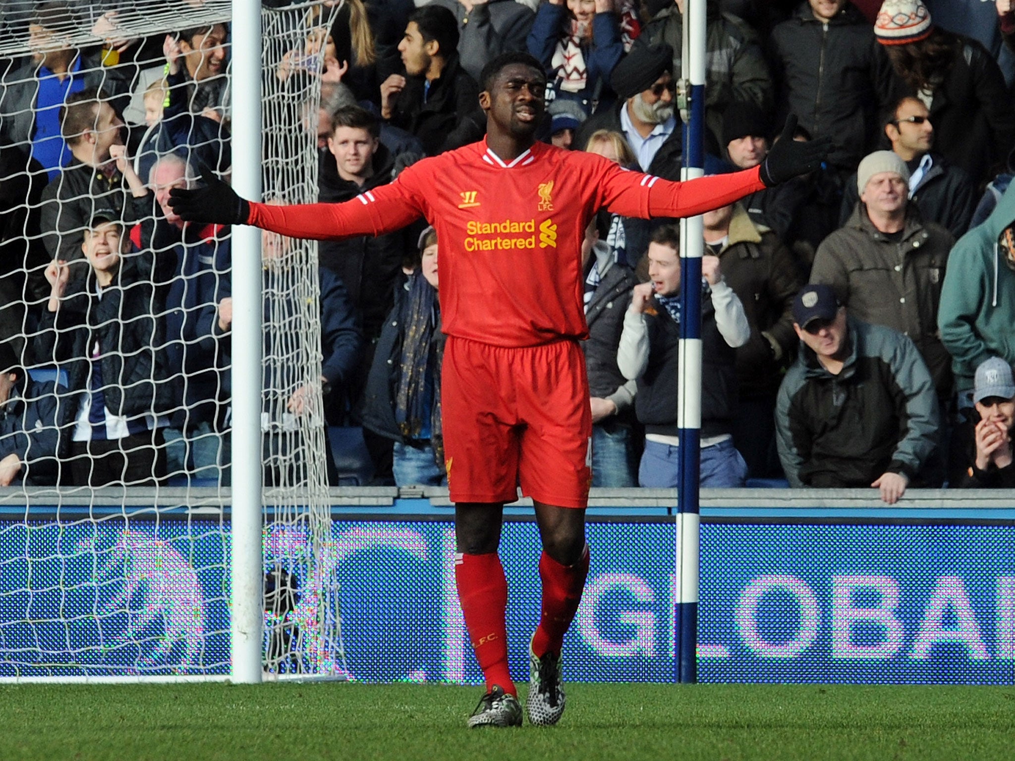 Kolo Toure shows his frustration with himself after giving the ball away to Victor Anichebe with the West Brom striker going on to score their equaliser