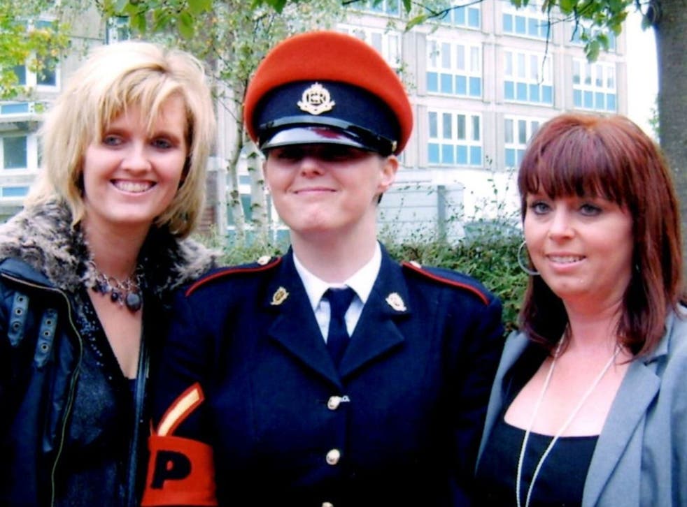 A family handout photograph of Corporal Anne-Marie Ellement, 30, who was found hanged at Bulford Barracks in 2011 after saying she had been raped. She is pictured with with her sisters, Khristina Swain (left) and Sharon Hardy