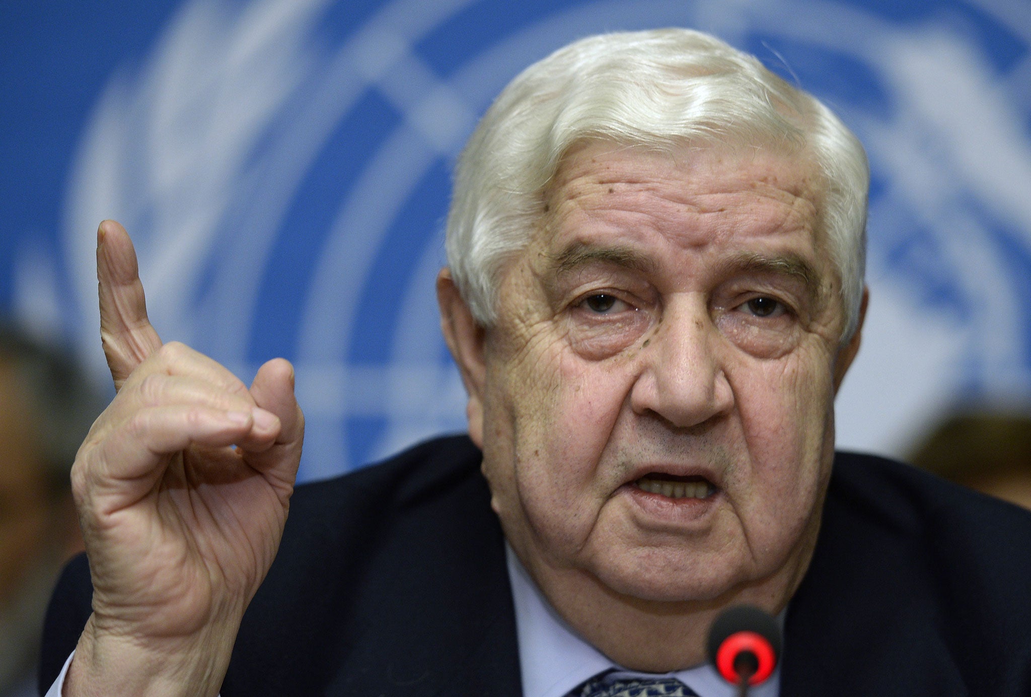 Syria's Foreign Minister and head of the Syrian government delegation Walid Muallem speaks during a press briefing on peace talks at the United Nations headquarters on January 31, 2014 in Geneva