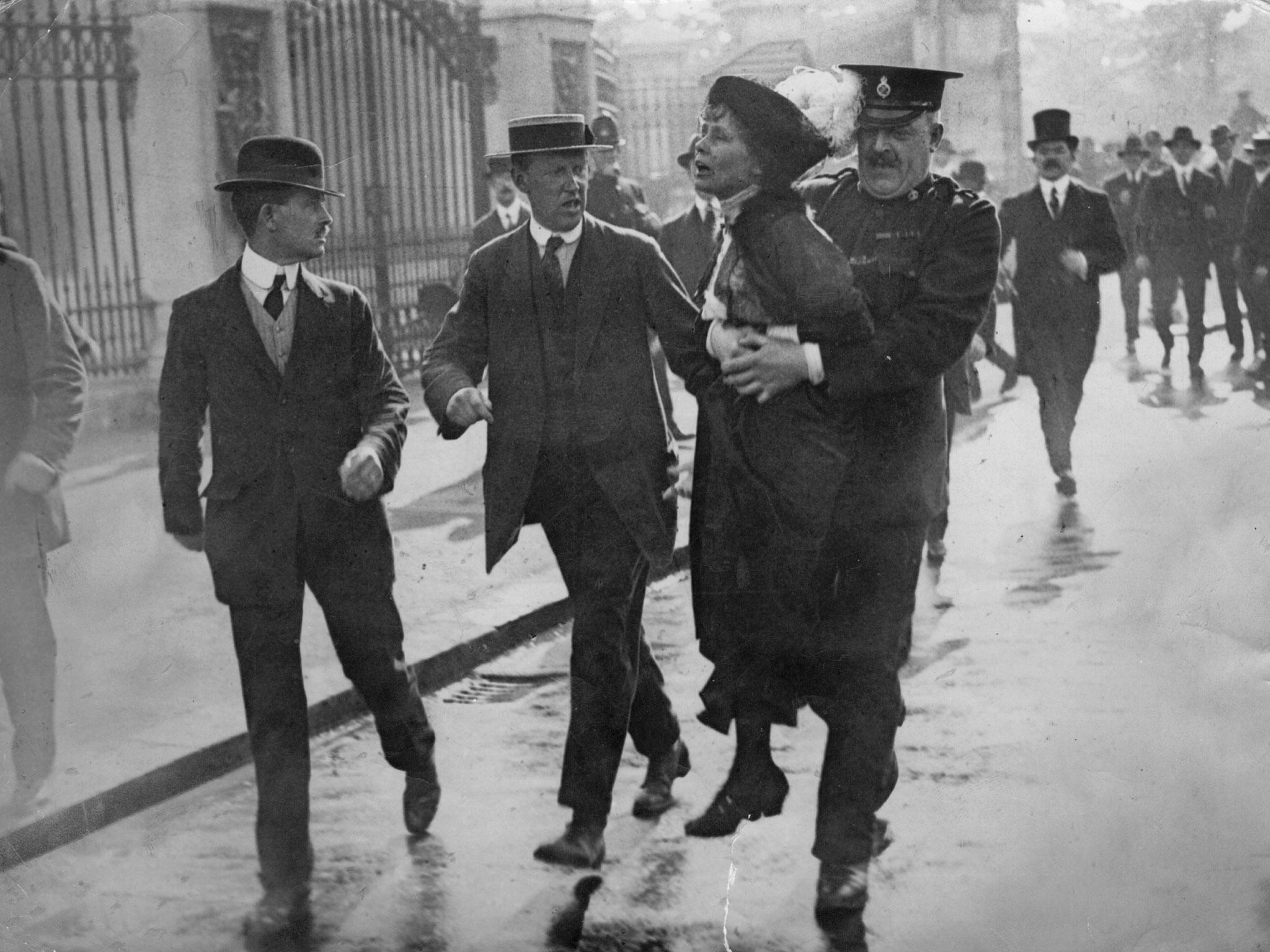 English suffragette Emmeline Pankhurst (1858 - 1928), is arrested at a demonstration outside Buckingham Palace, London