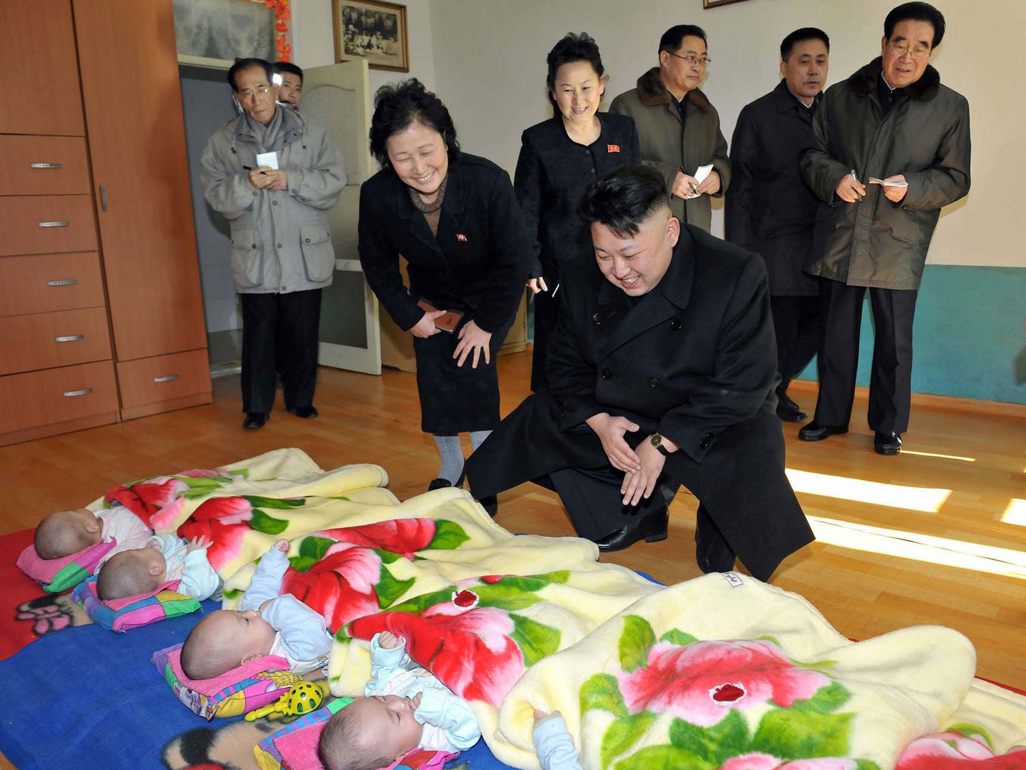 This undated picture released by North Korea's official Korean Central News Agency on February 4, 2014 shows North Korean leader Kim Jong-Un visiting a baby home and orphanage in Pyongyang