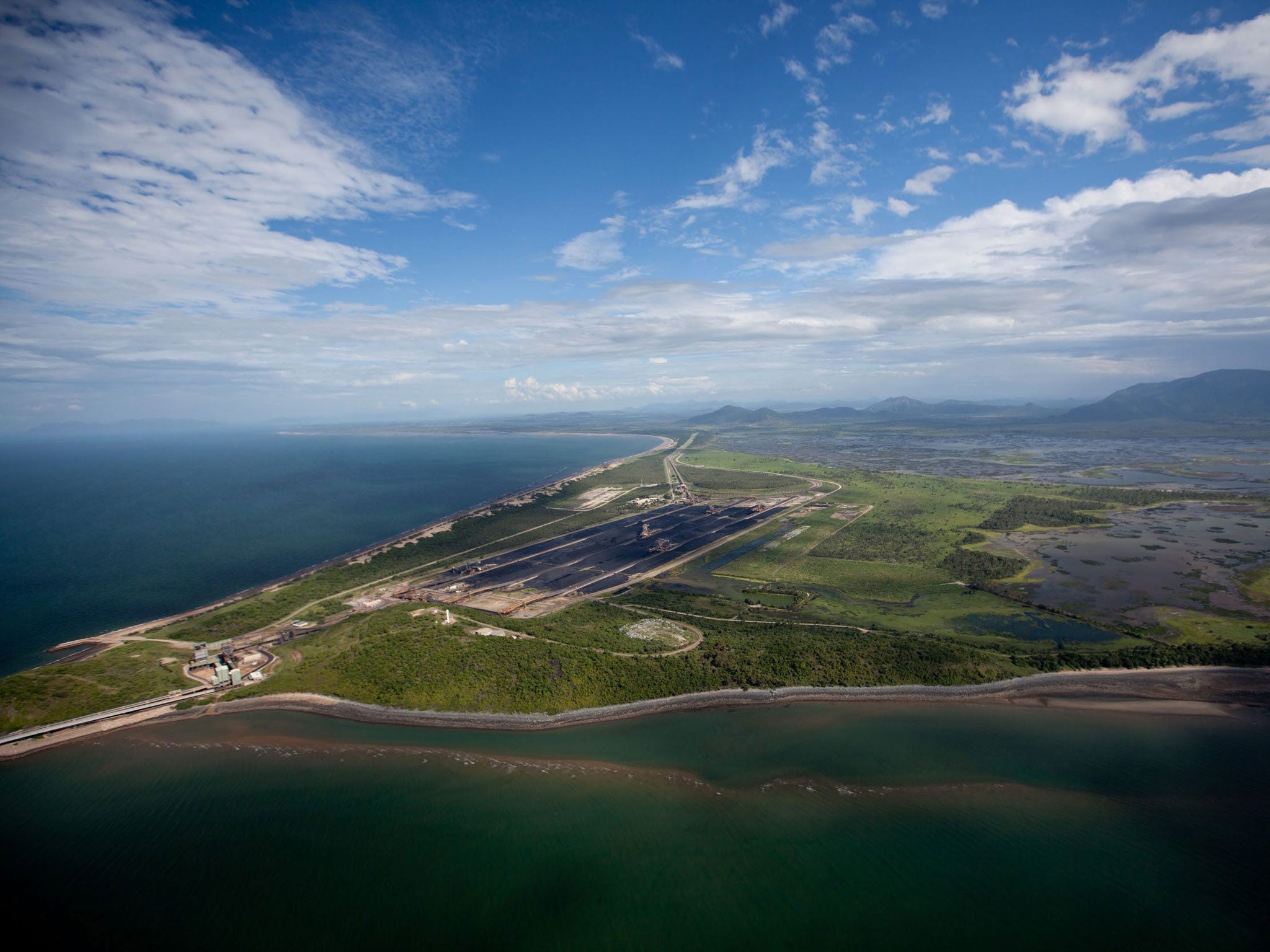 A picture made available by Greenpeace shows an aerial view of the Abbot Point coal point, where controversial plans to dump sludge in Great Barrier Reef Marine Park waters have been approved