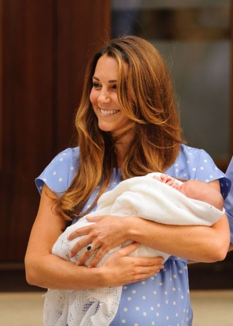 Duchess of Cambridge holding her son Prince George of Cambridge. The mother and son have since been pictured on his first overseas holiday in the Caribbean.