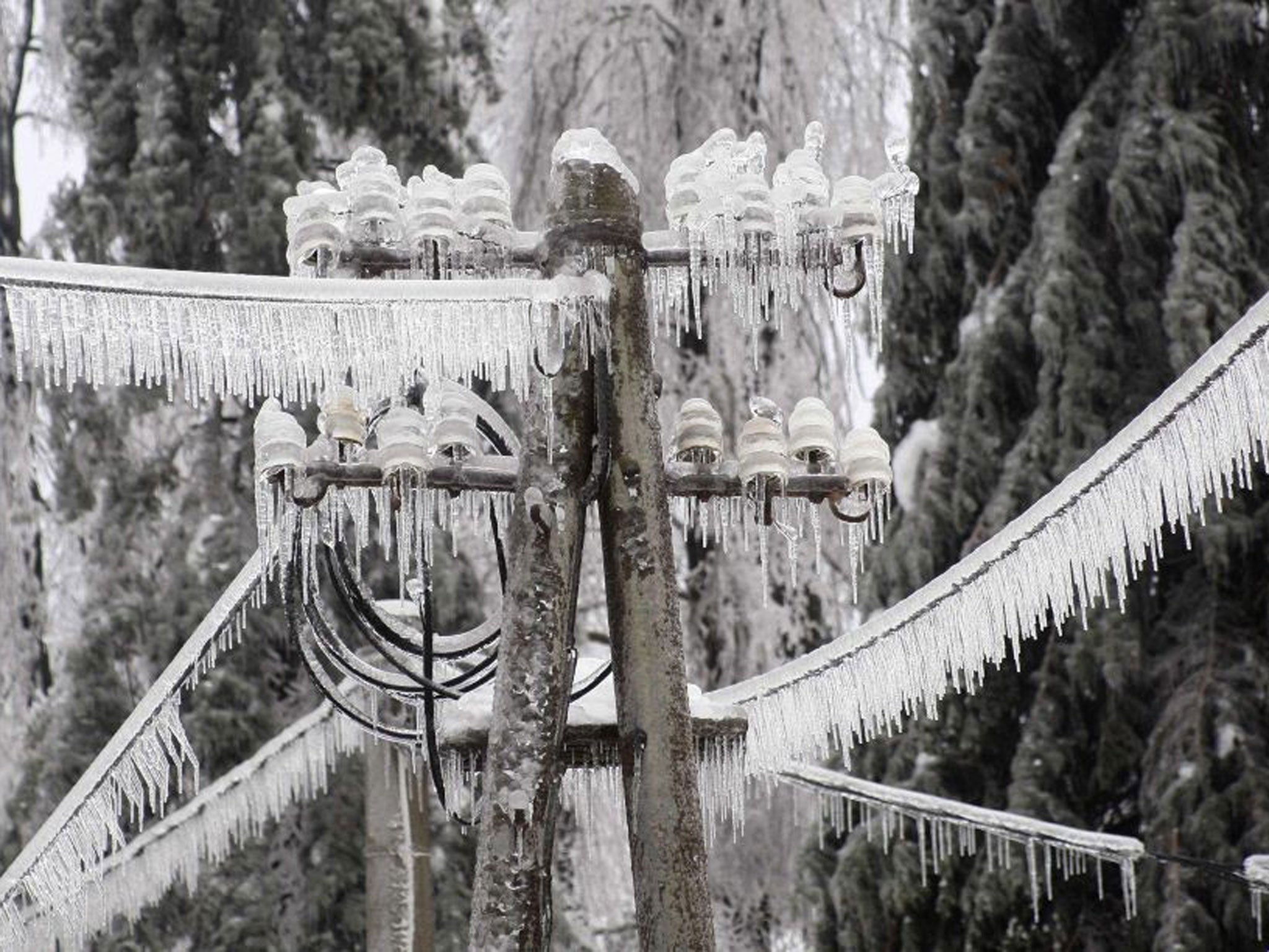 Ice-covered electric power pillar is seen in Postojna