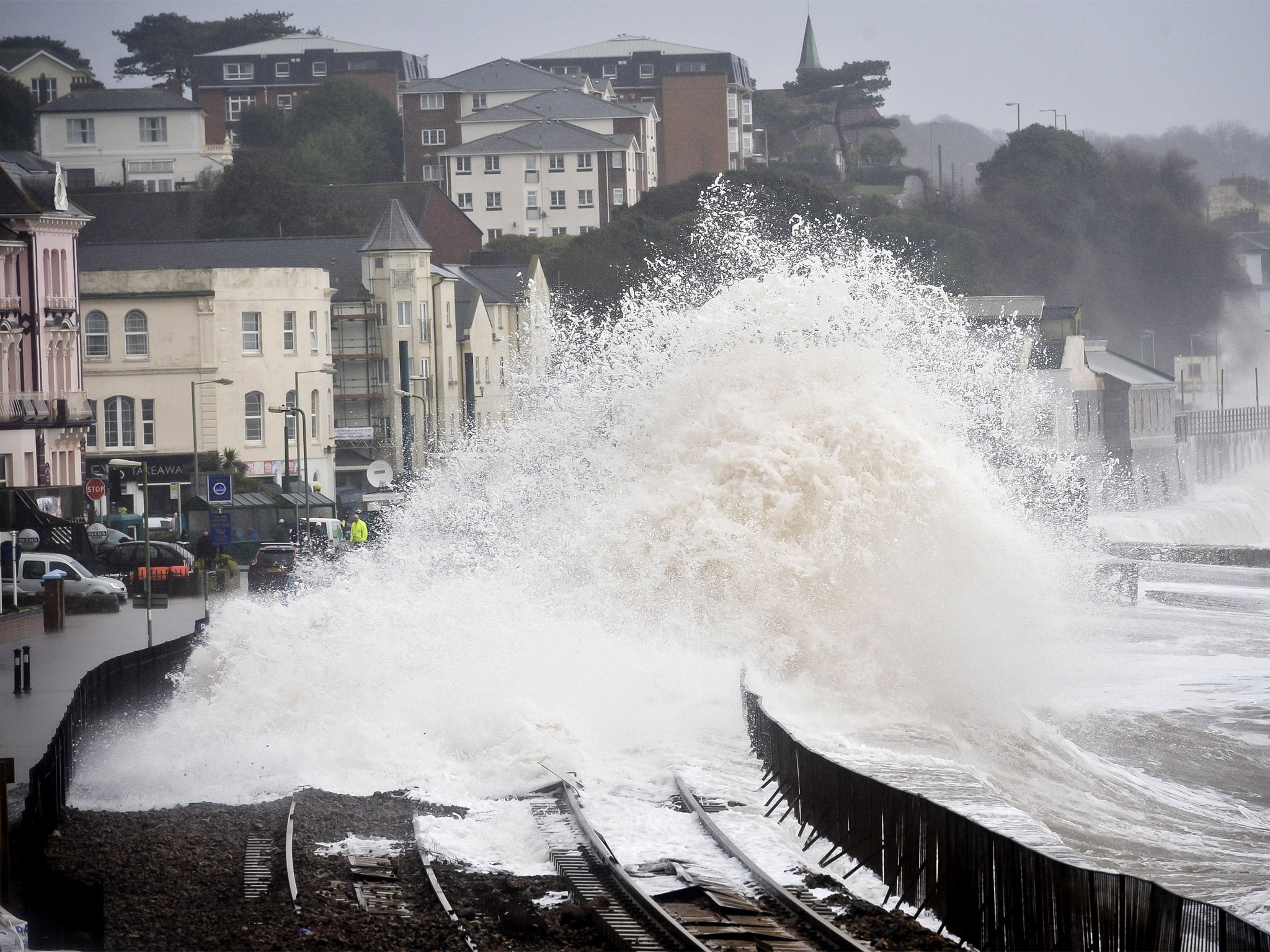 A huge waves break over the railway in Dawlish, causing damage