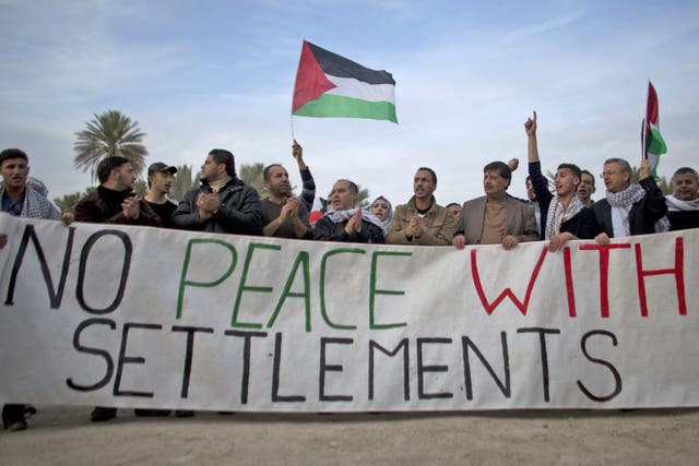 Palestinians activists protest against Jewish settlements last month
