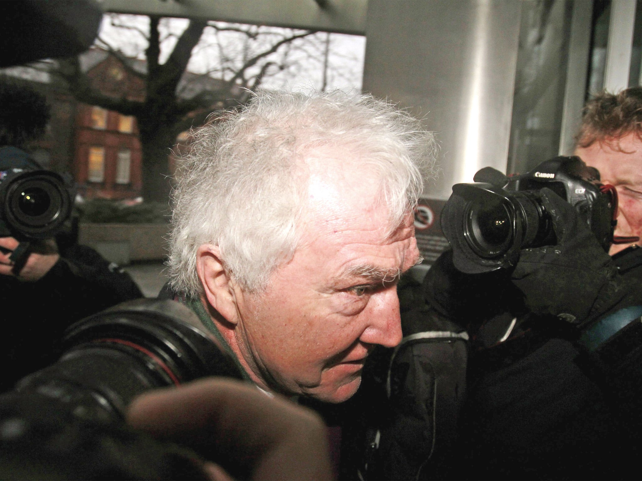 Sean FitzPatrick, former chairman of Anglo Irish, arriving at court in Dublin where he, along with two others, faces charges of trying to inflate the share price of the now-defunct bank