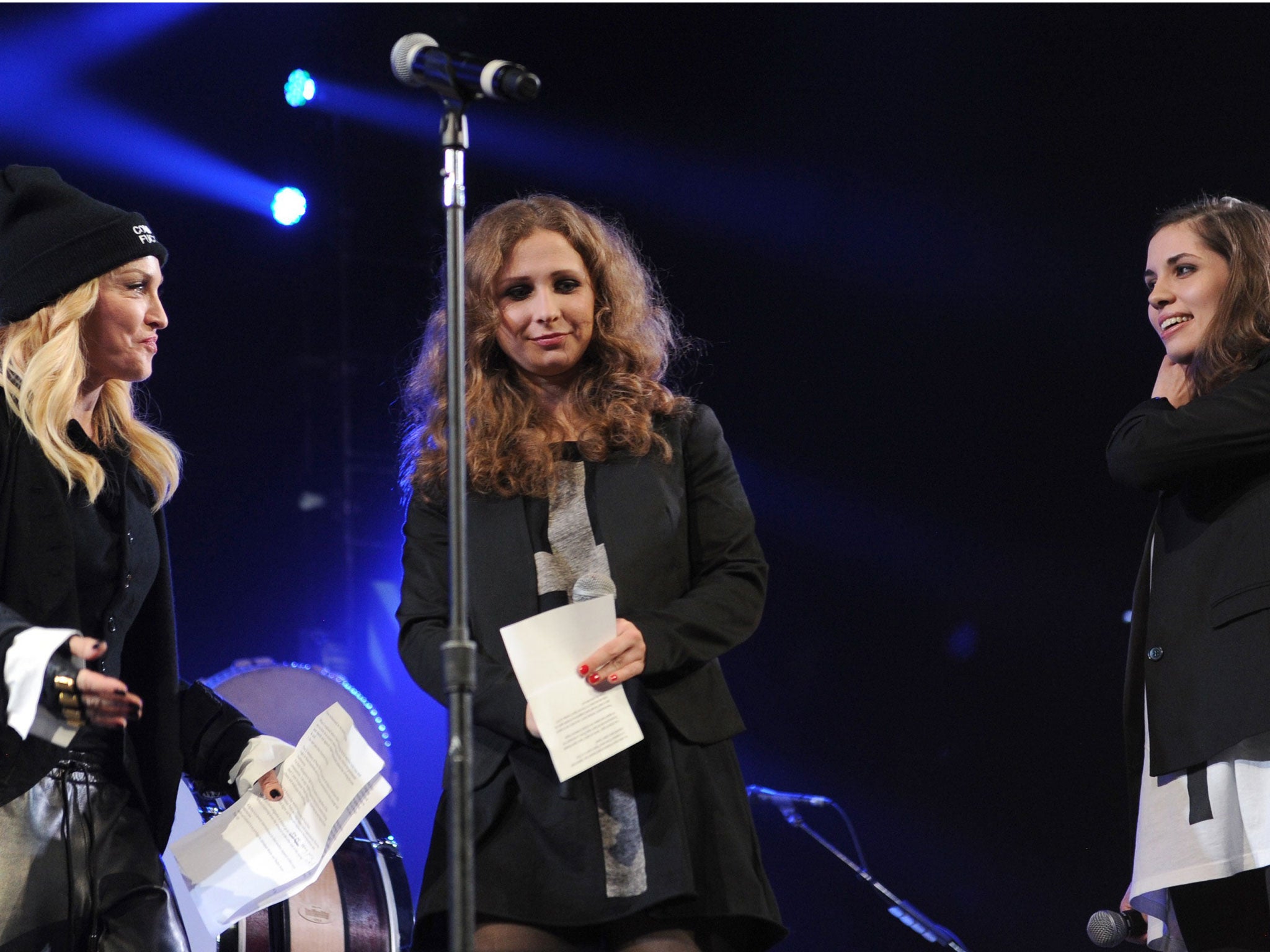Madonna introduces Maria Alyokhina and Nadezhda Tolokonnikova onstage at the Amnesty International Concert