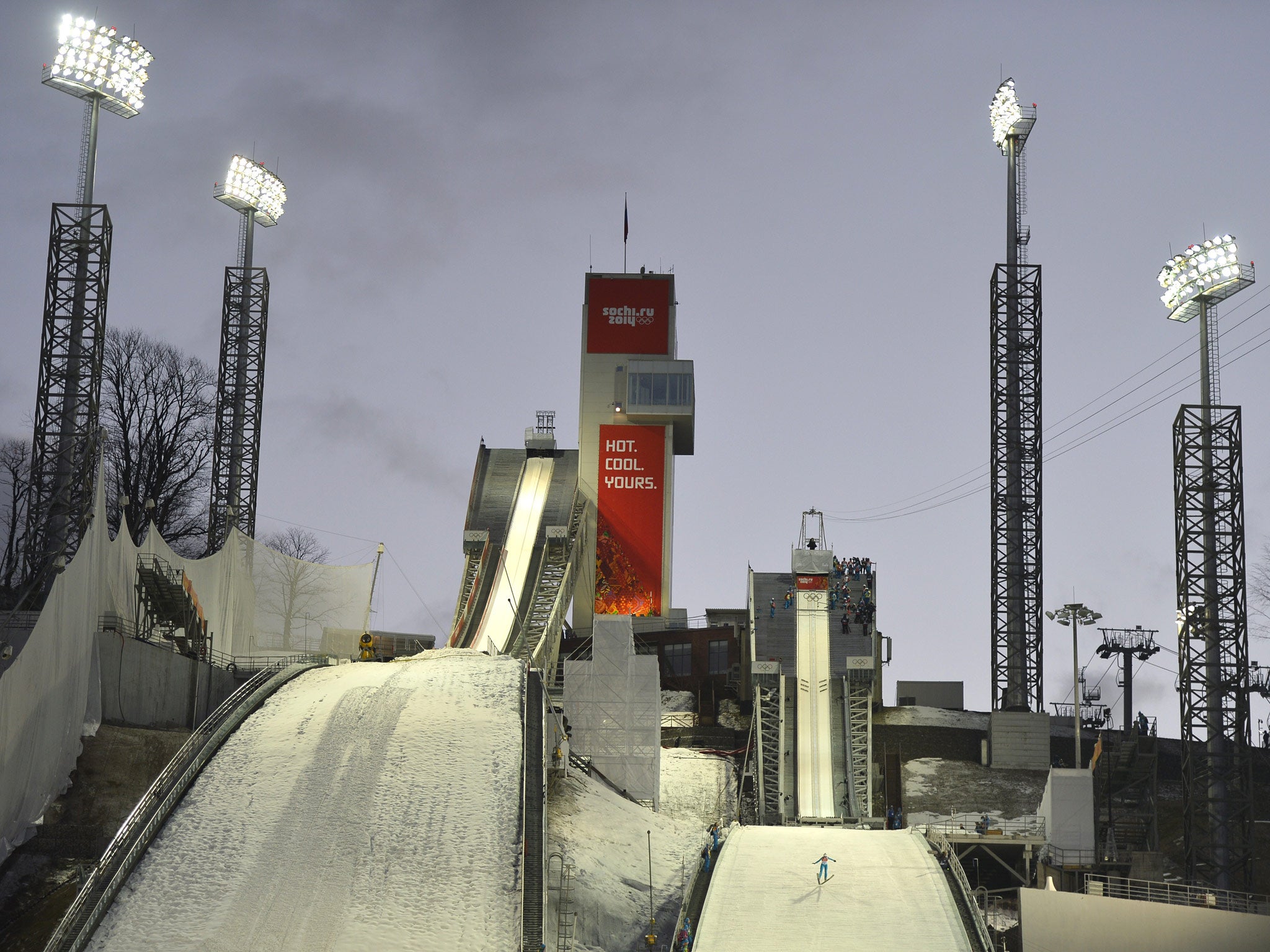 A ski jumper (R) is seen during practice at the RusSki Gorki Jumping Center