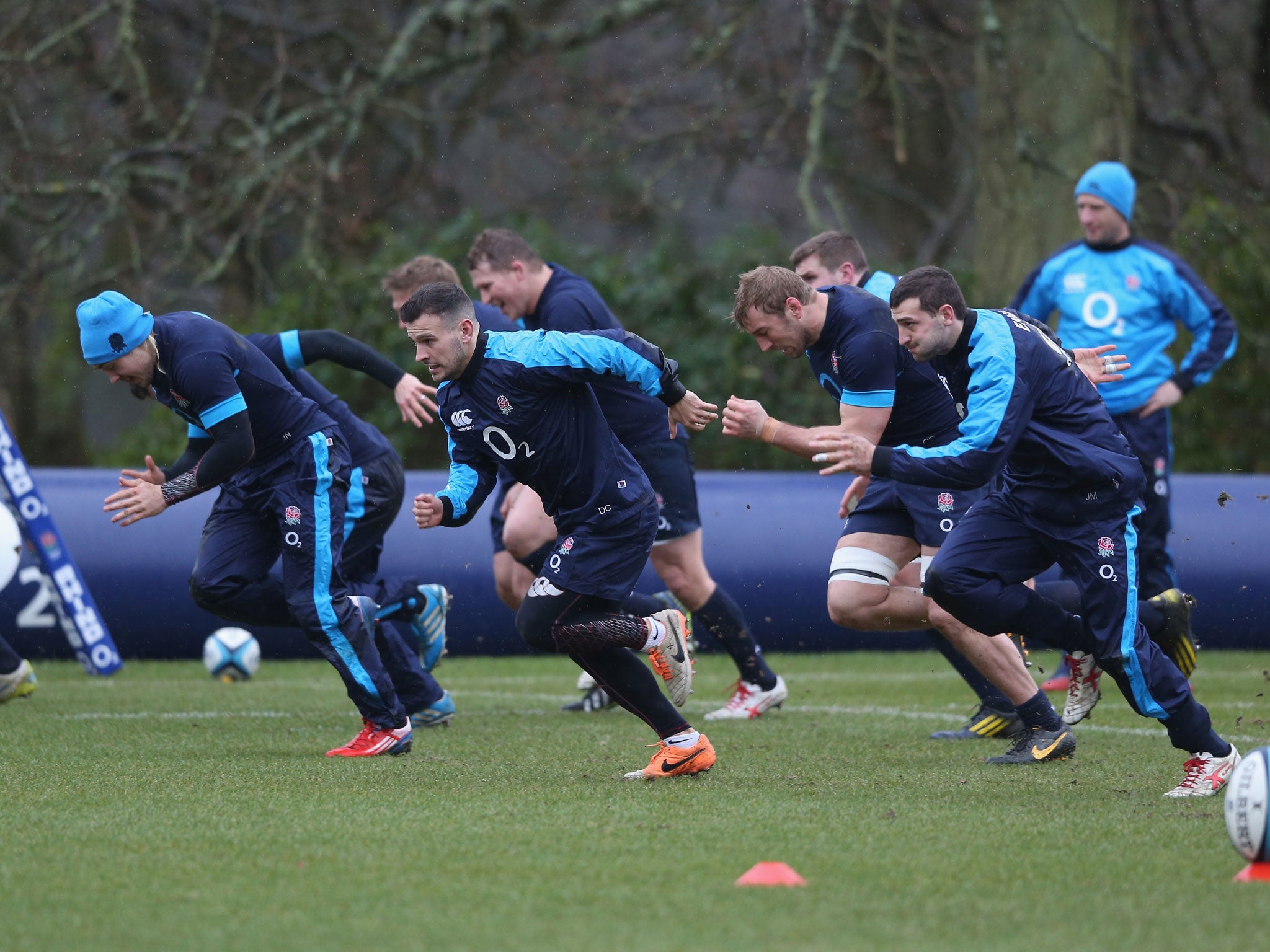 England players warm up ahead of a Pennyhill Park training session yesterday