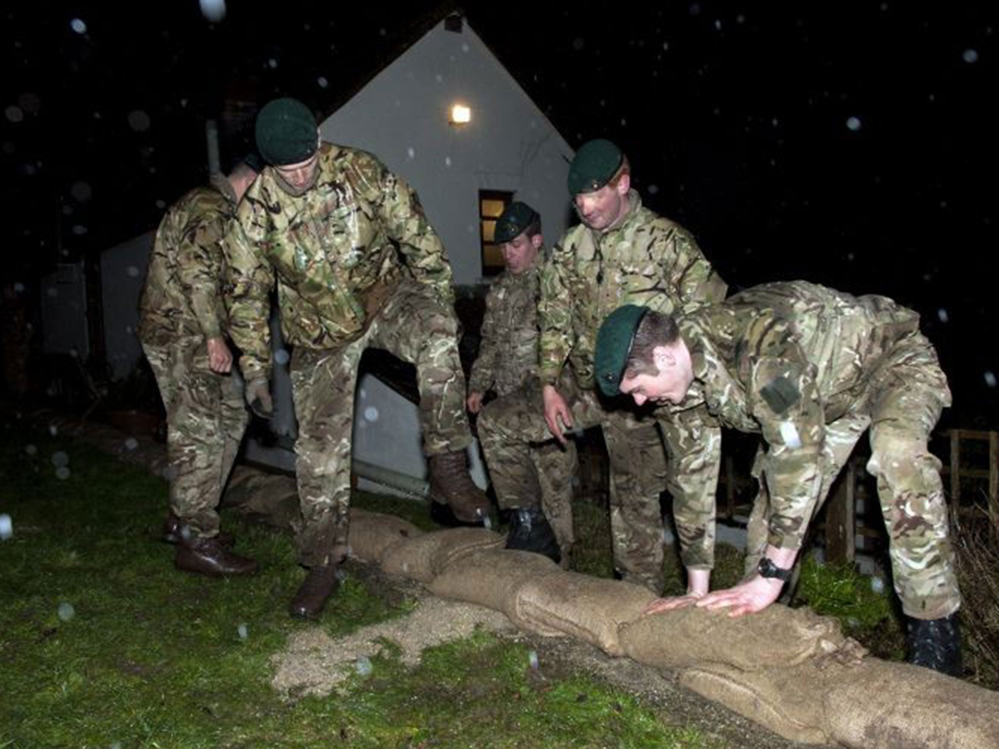 Royal Marines who had been in the region building sandbag defences were drafted in to assist with the evacuation of residents in the village of Moorland this morning