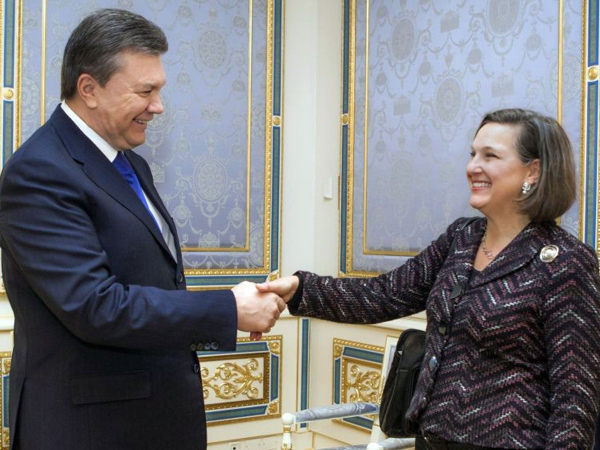 Victoria Nuland greets the Ukrainian president Viktor Yanukovych