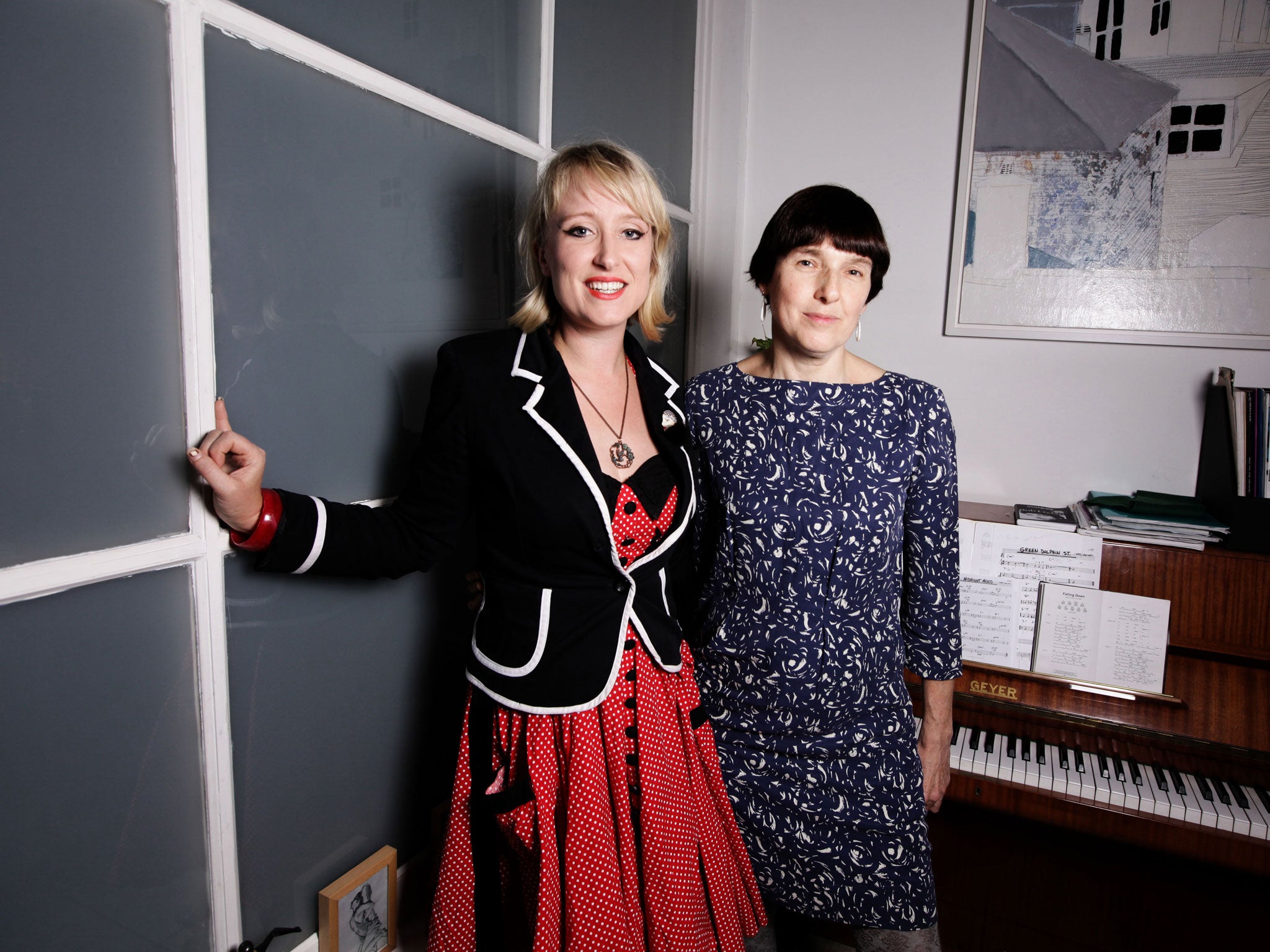 Composer Gwyneth Herbert (left, in red dress) with playwright Diane Samuels, the collaborators on the musical