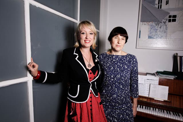 Composer Gwyneth Herbert (left, in red dress) with playwright Diane Samuels, the collaborators on the musical 