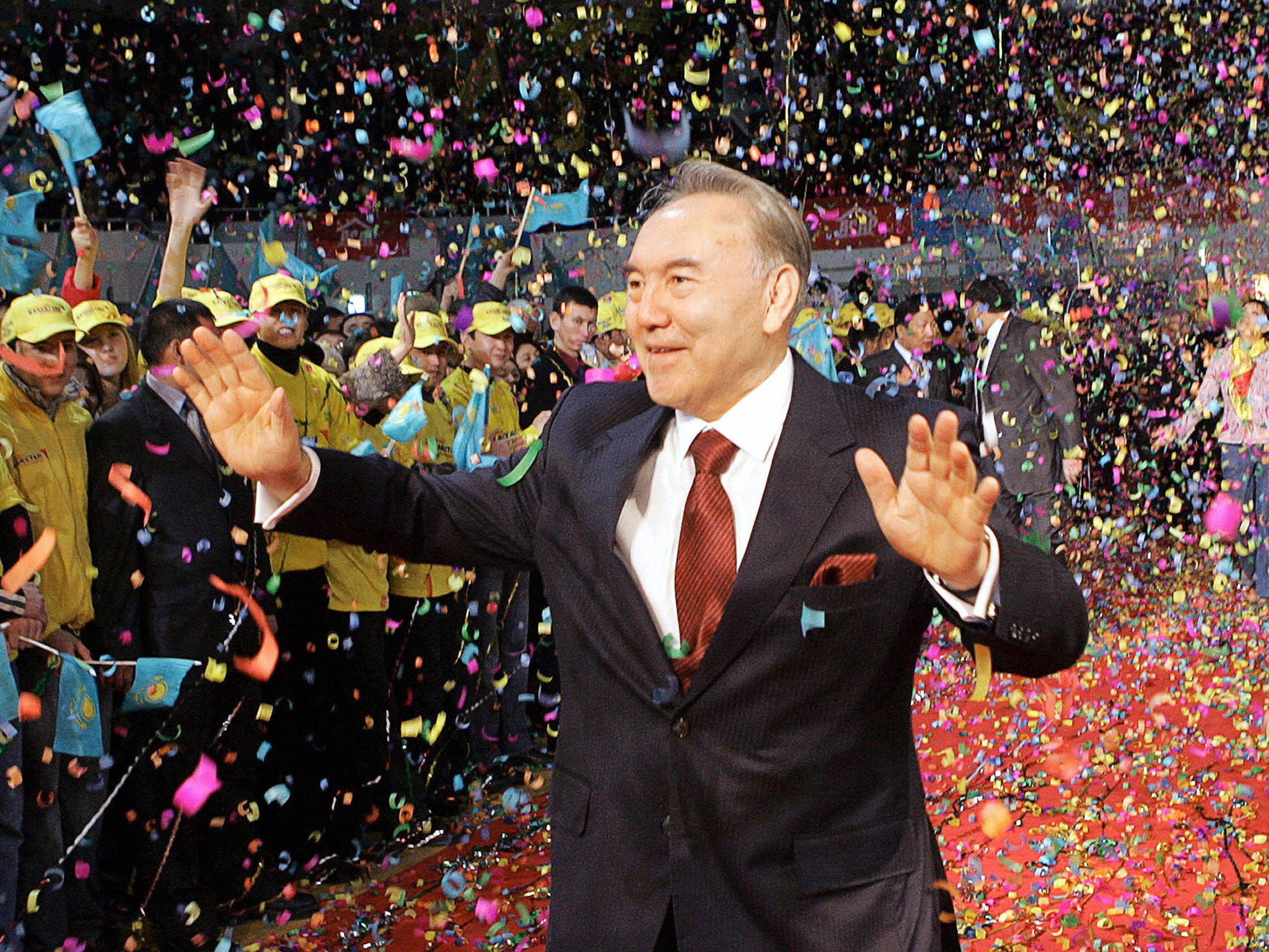 Kazakh President Nursultan Nazarbayev waves to supporters