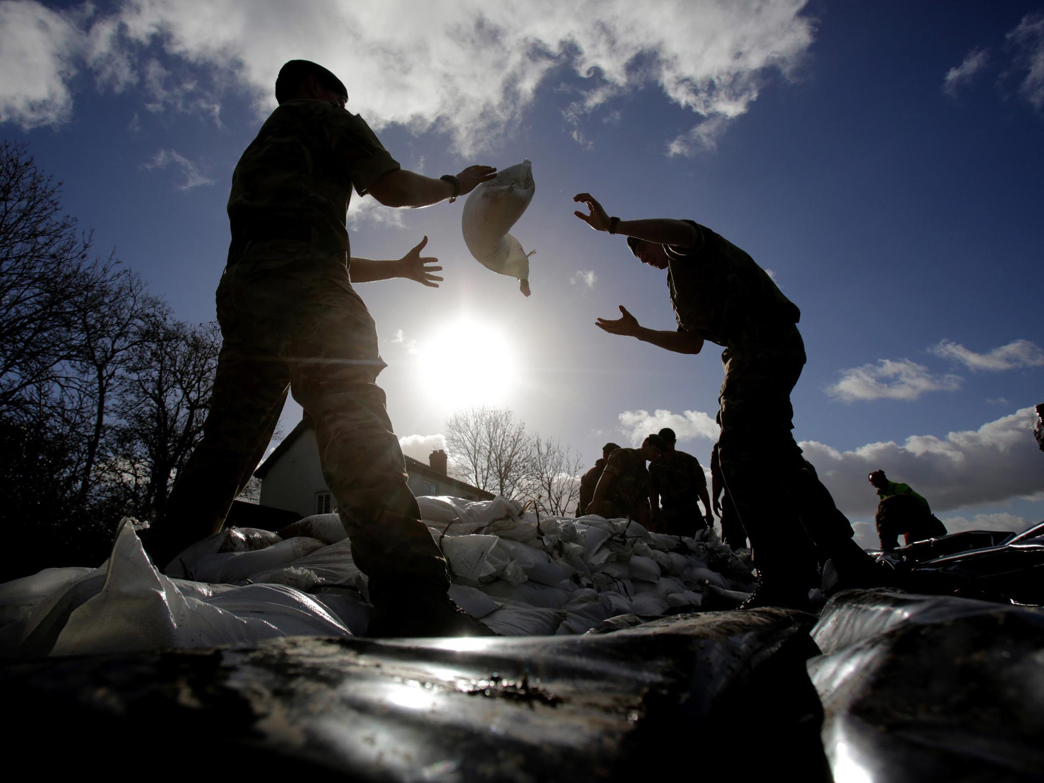 Marines from 40 Commando help build a sandbag wall around a property in Moorland as they help with flood defences on the Somerset Levels near Bridgwater