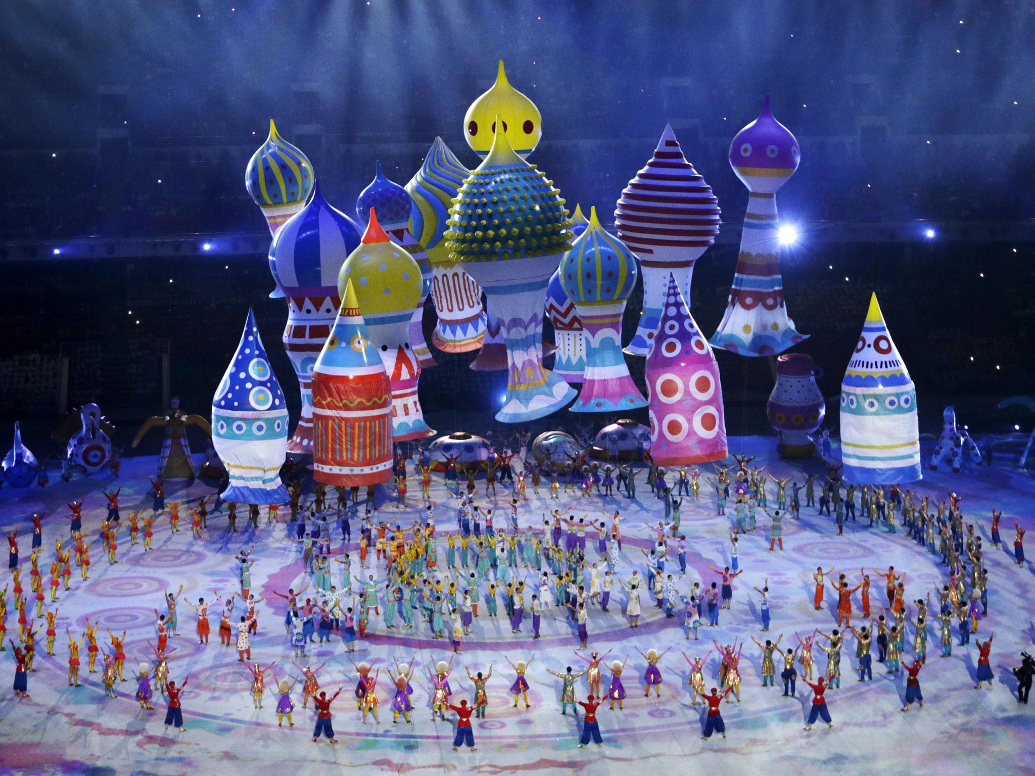 Artists in colourful costumes perform during the opening ceremony of the 2014 Winter Olympics in the Fisht Olympic Stadium Sochi, Russia