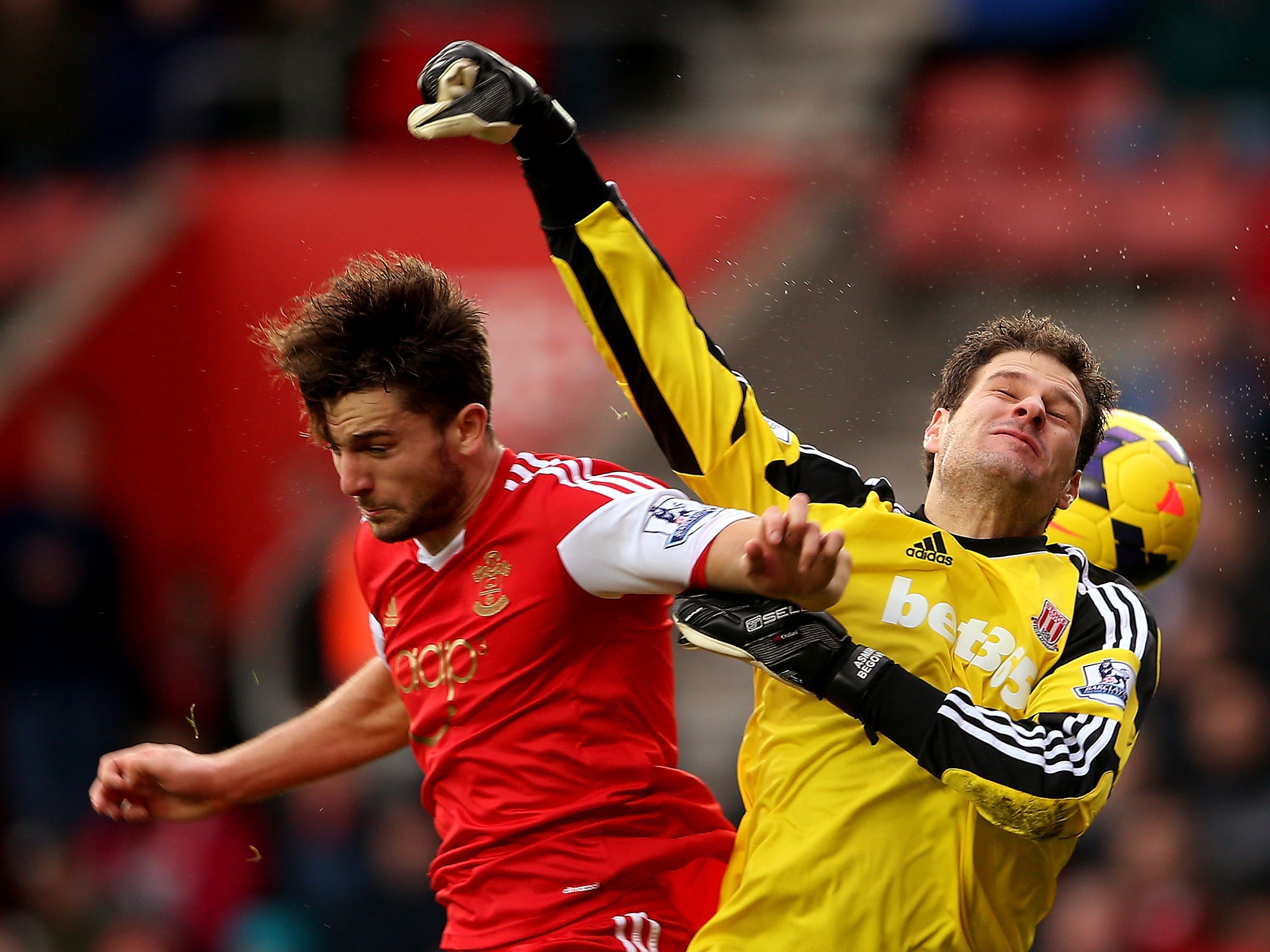 Jay Rodriguez and Asmir Begovic contest for the ball during the Premier League fixture between Southampton and Stoke