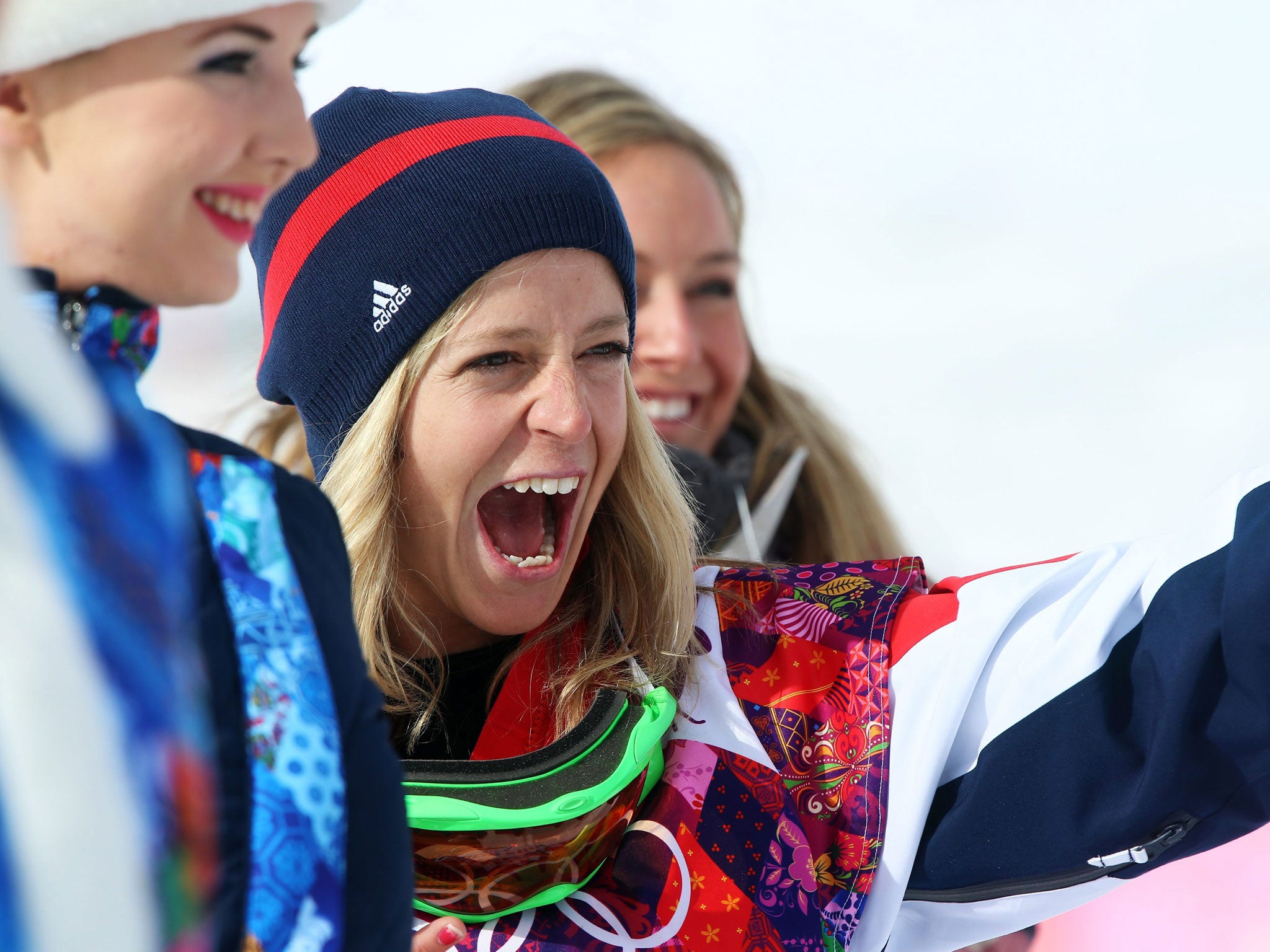 Jenny Jones of Great Britain celebrates an historic bronze on the snow after the flower ceremony of the Women's Snowboard Slopestyle final at Rosa Khutor Extreme Park at the Sochi 2014 Olympic Games, 9 February 2014