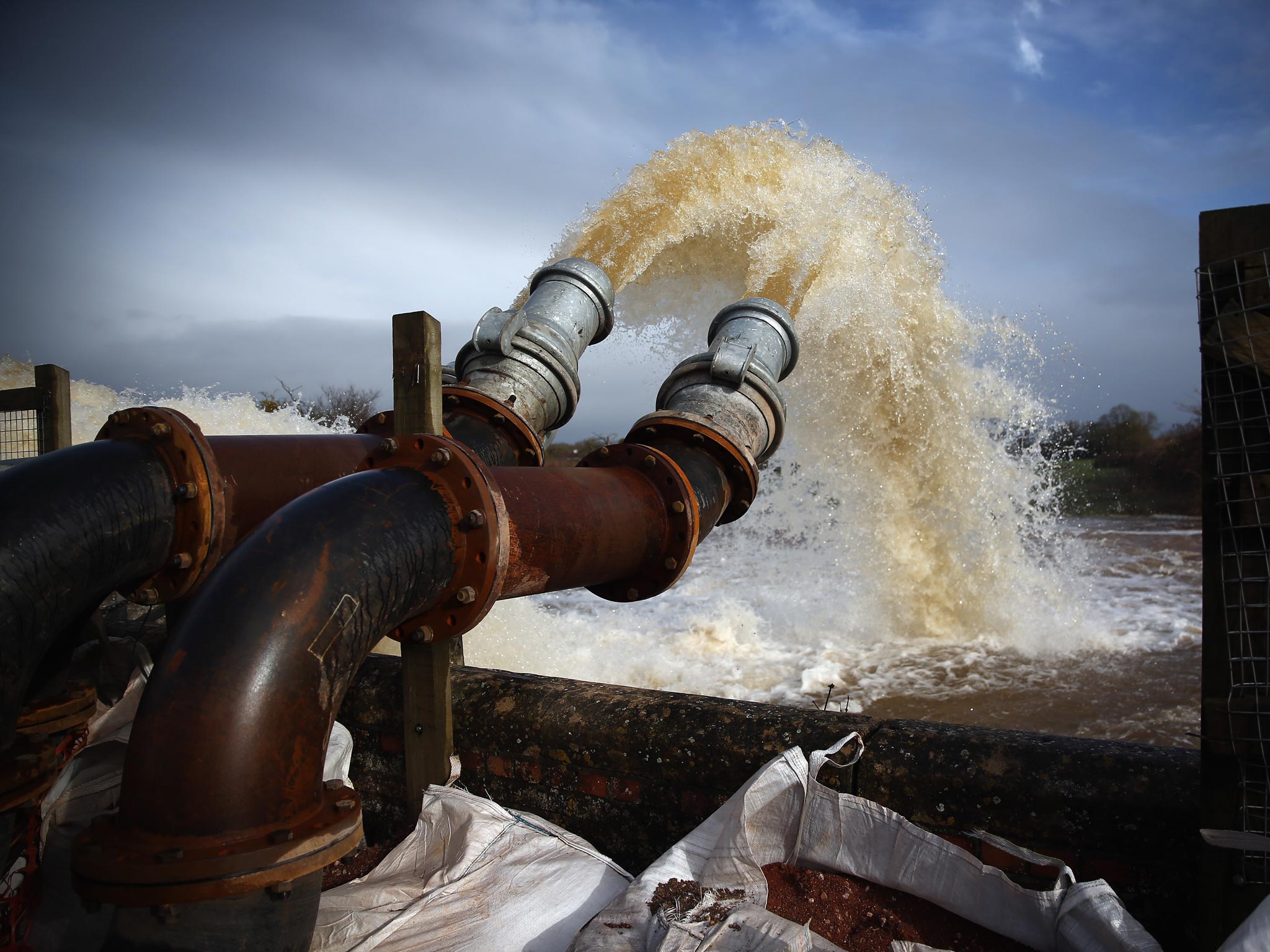 Flood water is seen pumped into the river at the pumping station near Fordgate on the Somerset Levels near Bridgwater
