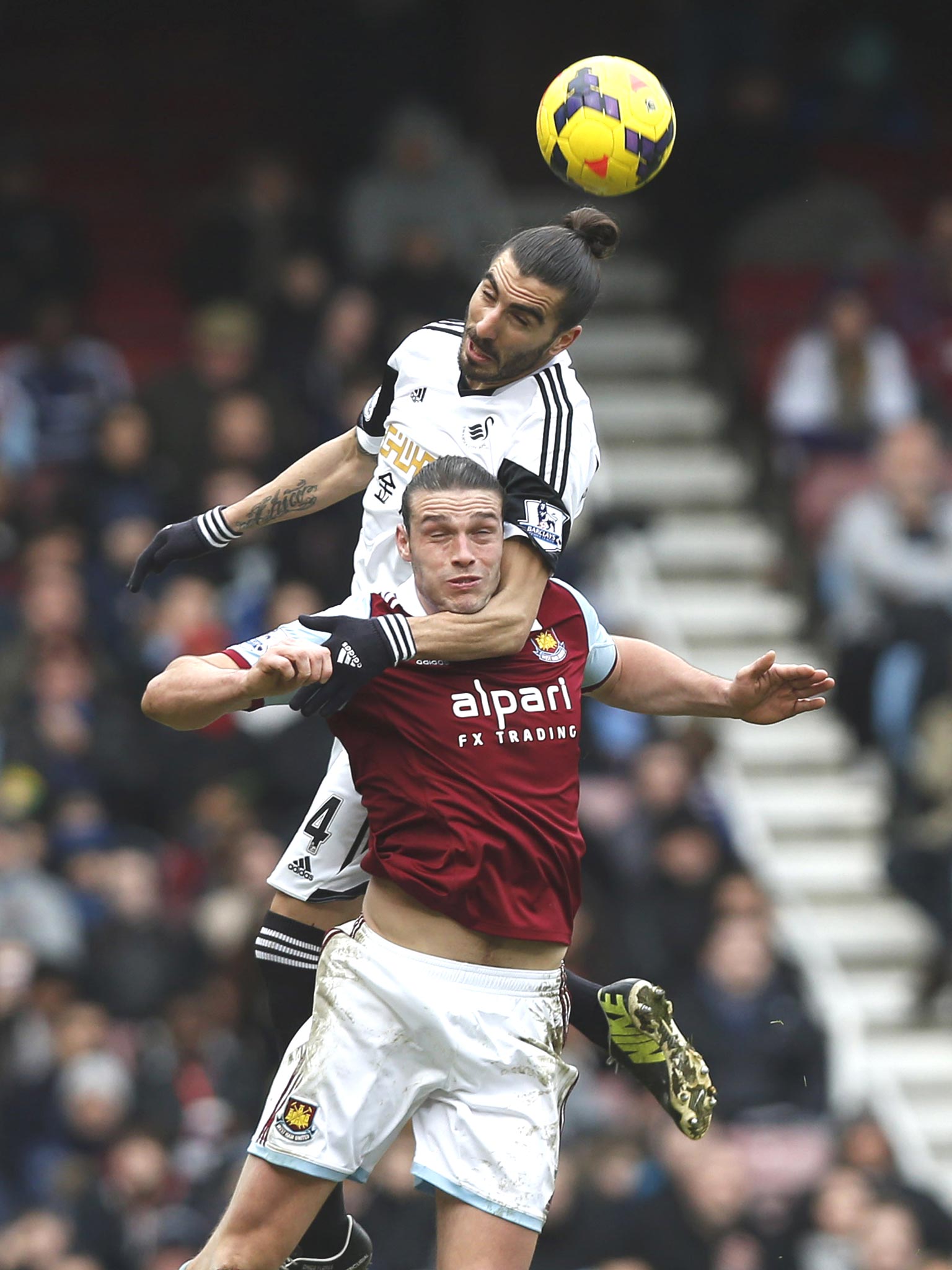Andy Carroll clashes with Swansea’s Chico Flores before the West Ham striker was sent off