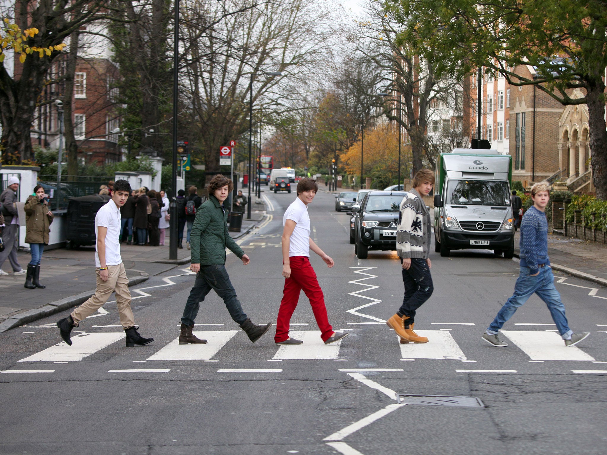 One Direction recreate The Beatles' Abbey Road album cover at the zebra crossing outside the London studios in November 2010