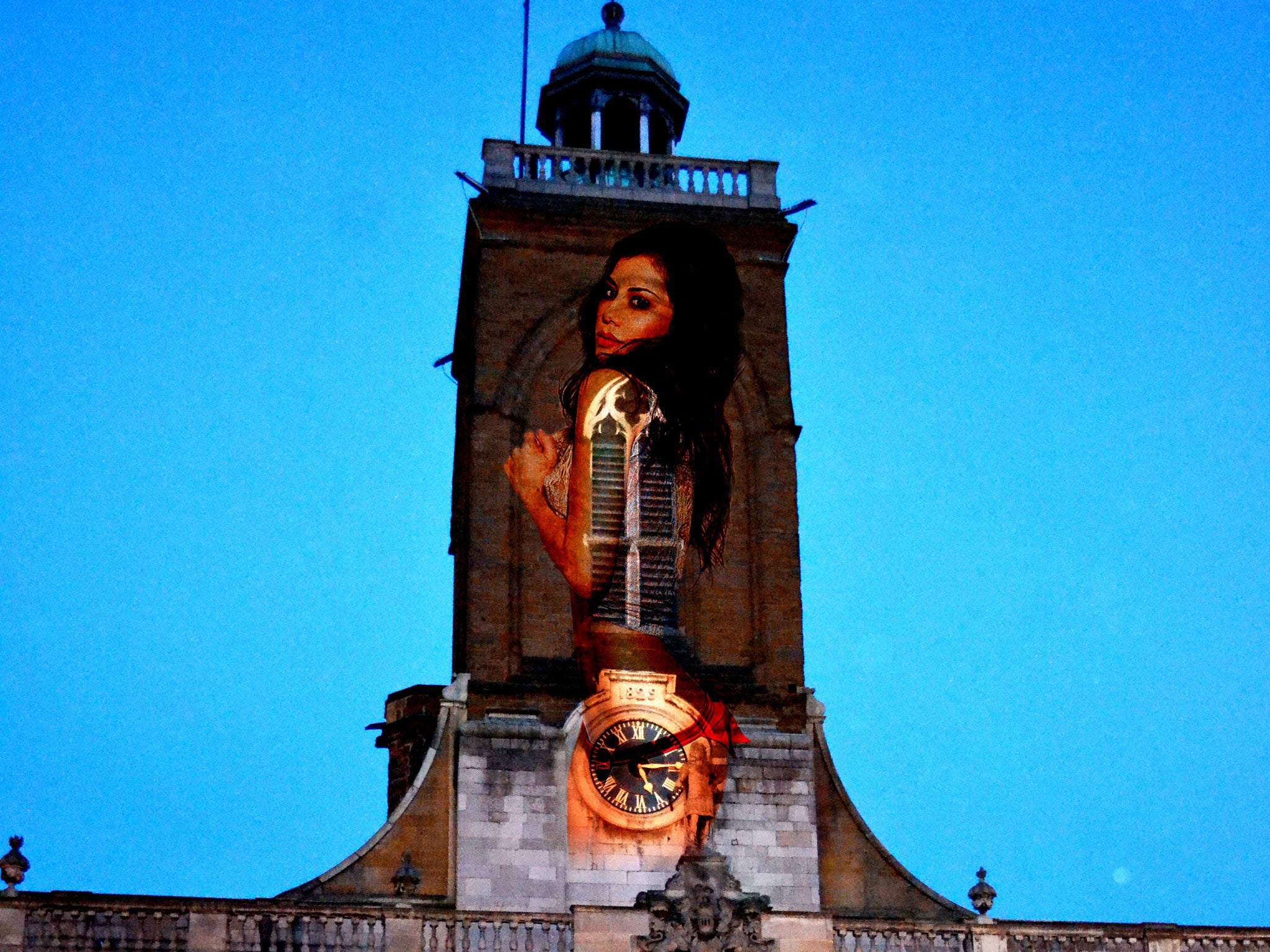 The casino which carried out the stunt said it 'meant no offence' by the promotion, which saw a 30ft semi-naked model projected onto the church tower at All Saints', Northampton