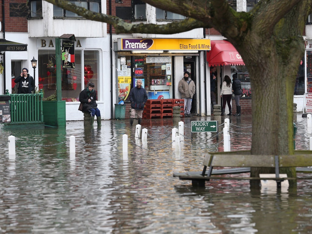 The vilage green is under flood water after the river Thames burst it's banks on February 10, 2014 in Datchet, England.