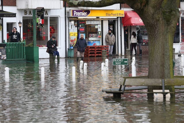 The vilage green is under flood water after the river Thames burst it's banks on February 10, 2014 in Datchet, England.