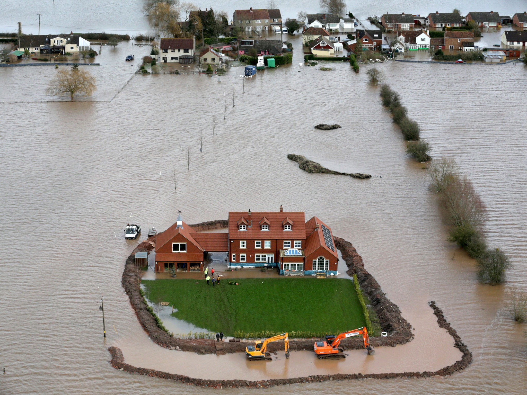 The house had until yesterday been protected by the wall which was constructed as the waters rose.